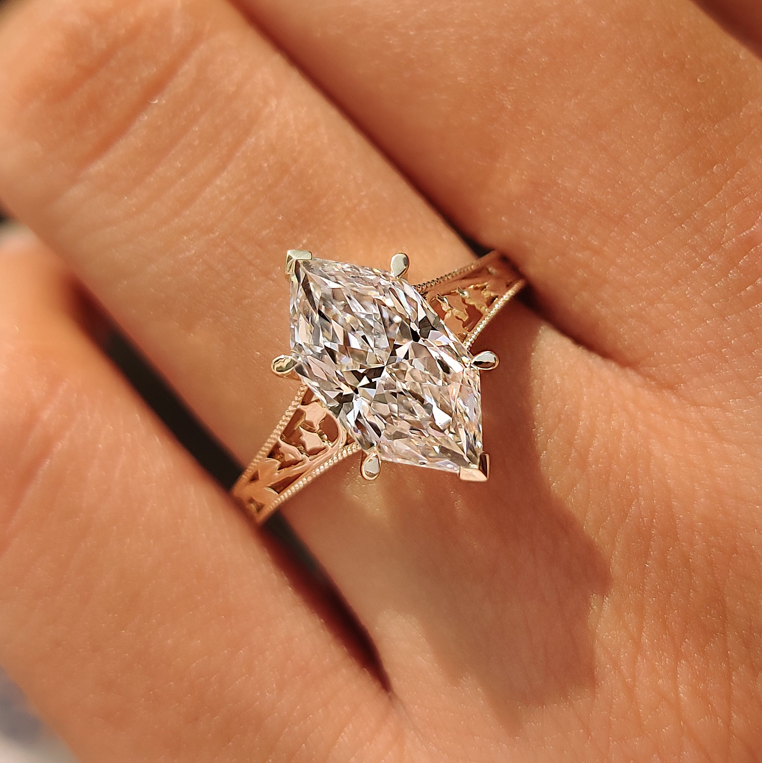 Dutch marquise lab grown diamond in a cathedral setting.
