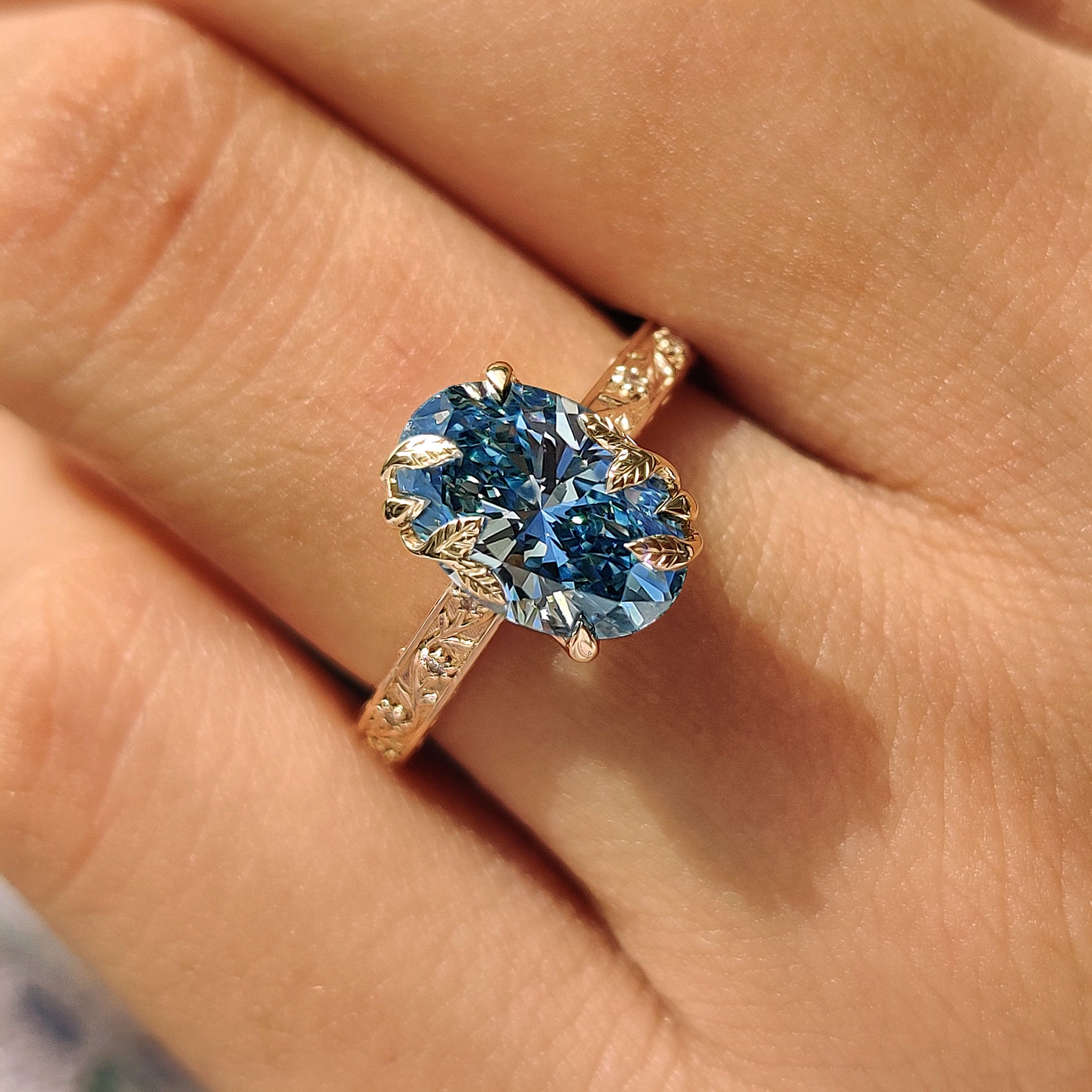Vintage inspired oval diamond ring with floral details

