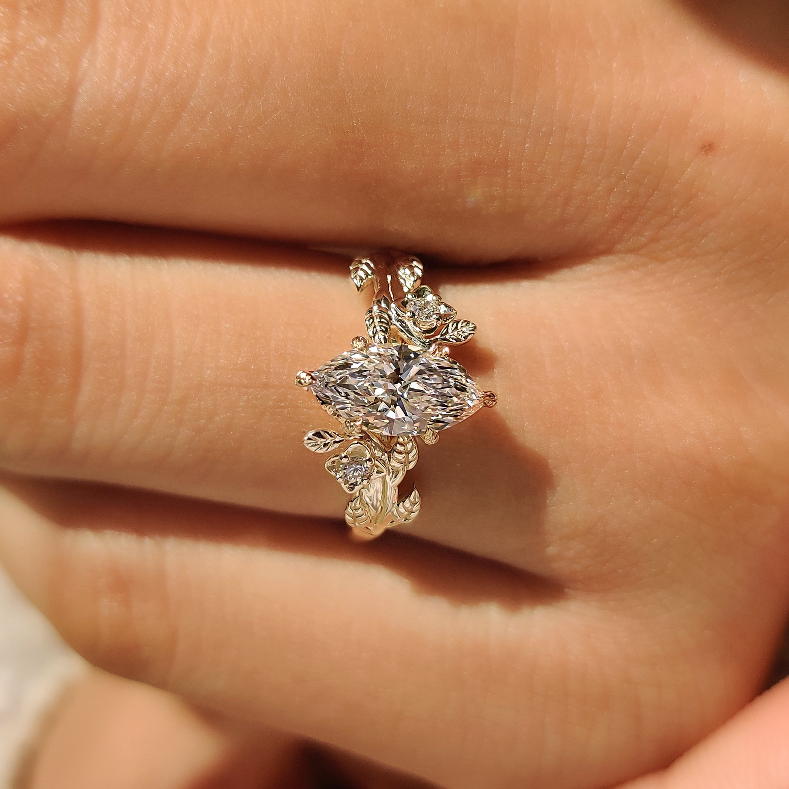 Nature inspired diamond ring with marquise center stone design

