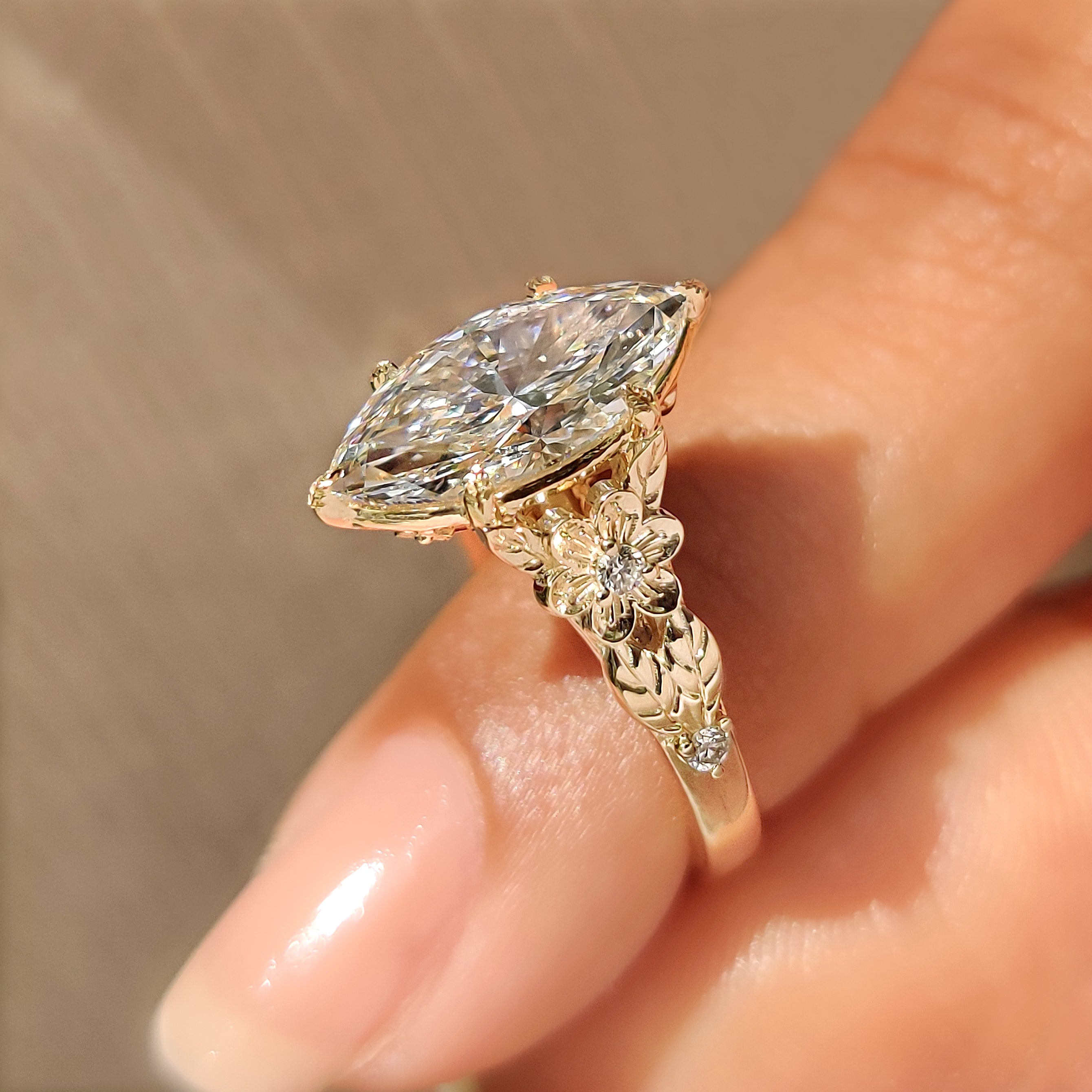 Nature inspired diamond ring with marquise center stone design
