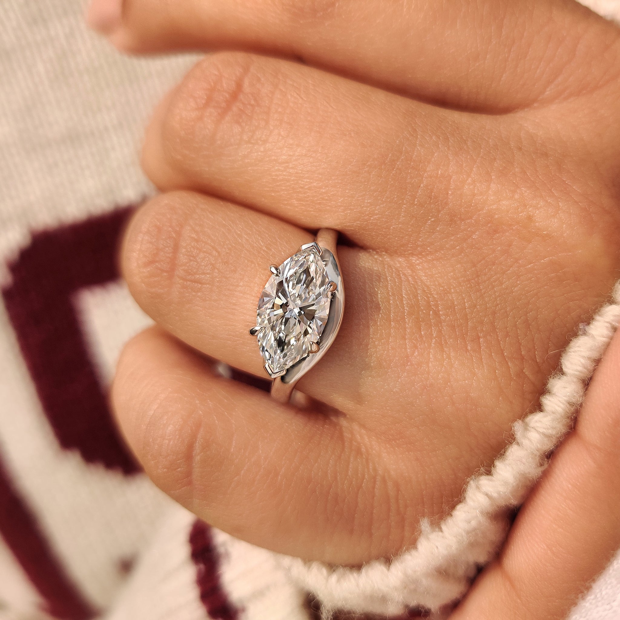 Lab grown marquise diamond engagement ring east west setting
