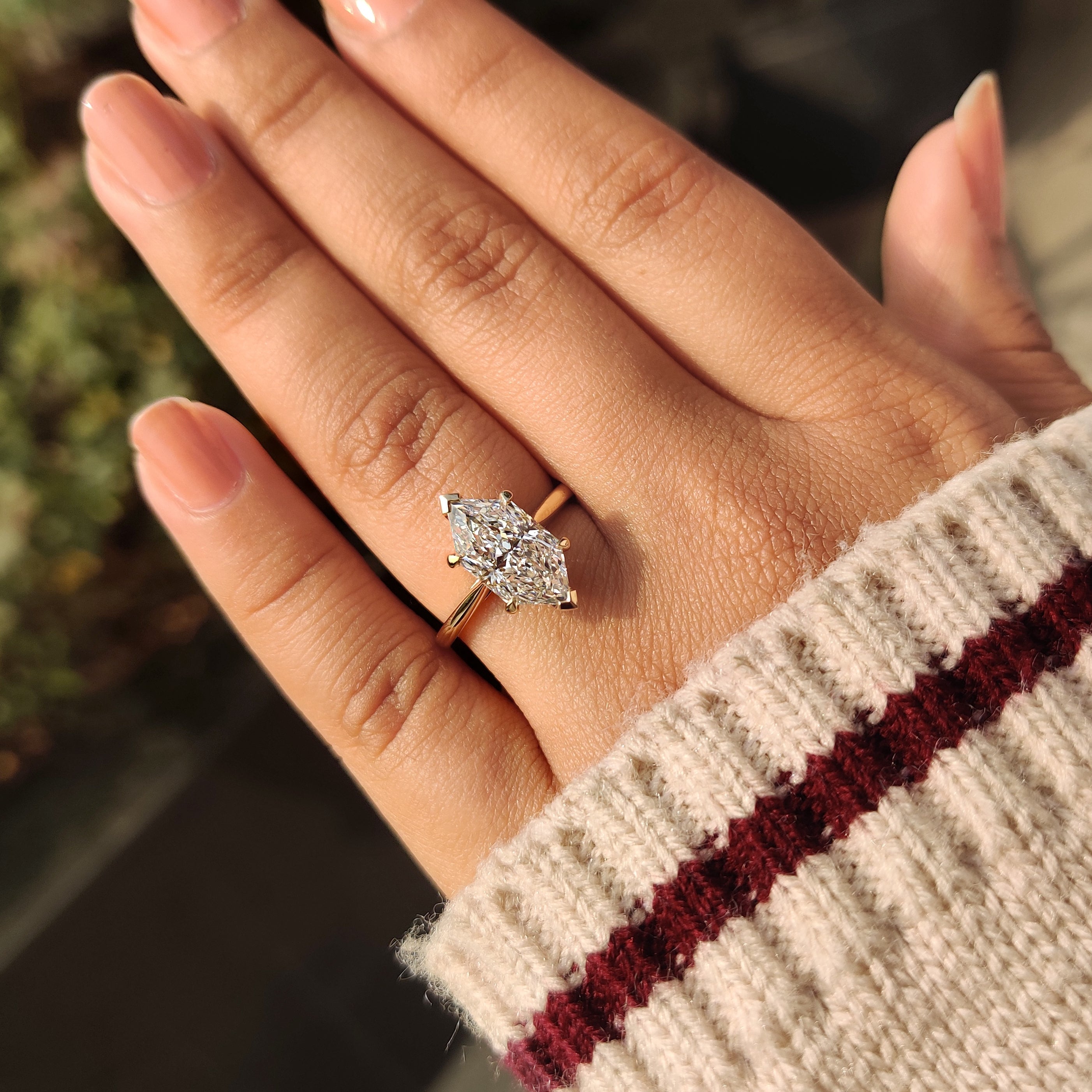 Dutch marquise diamond ring with cathedral and tapered band.
