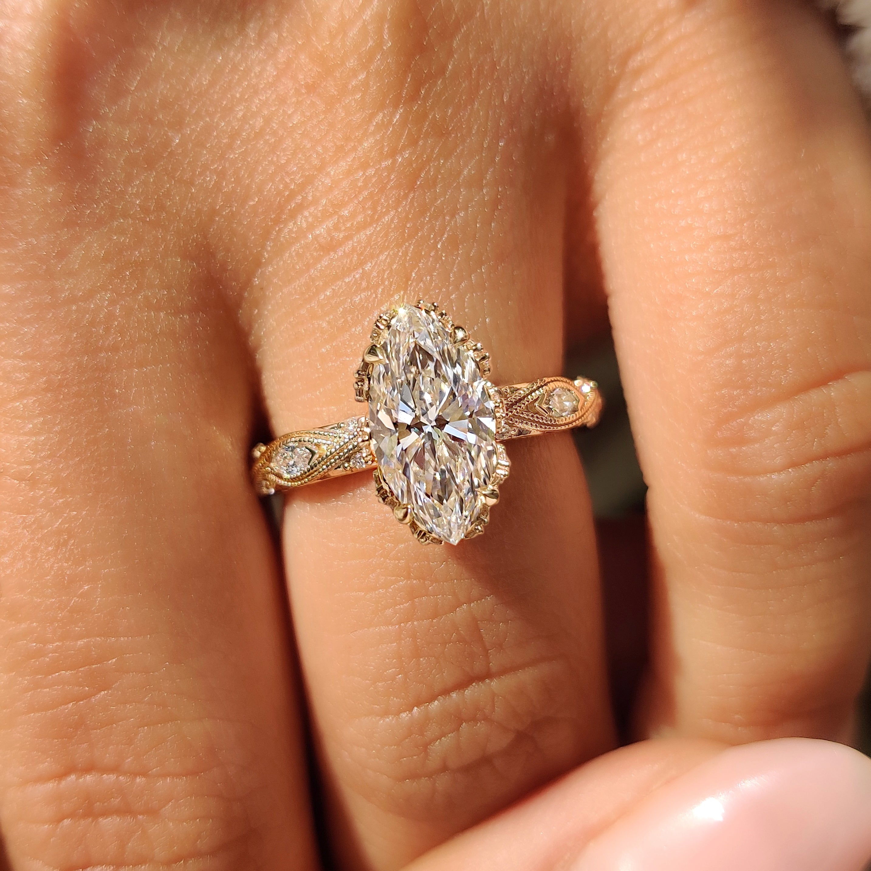 Marquise diamond ring with four claw prong setting.
