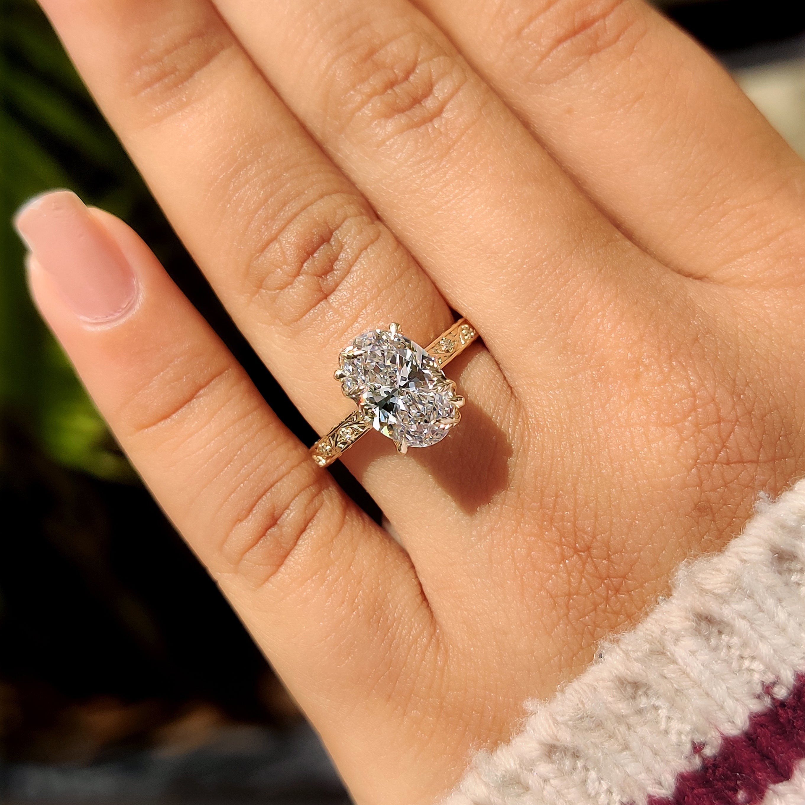 Nature inspired ring with oval center diamond and euro shank
