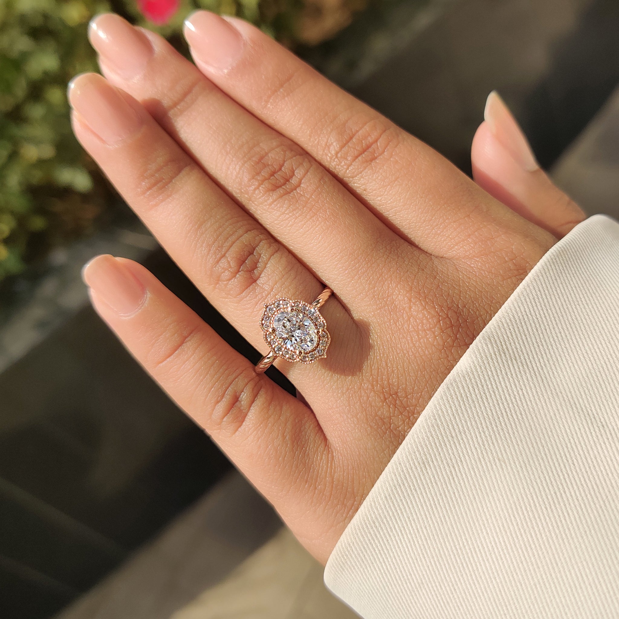Vintage oval diamond engagement ring with milgrain setting
