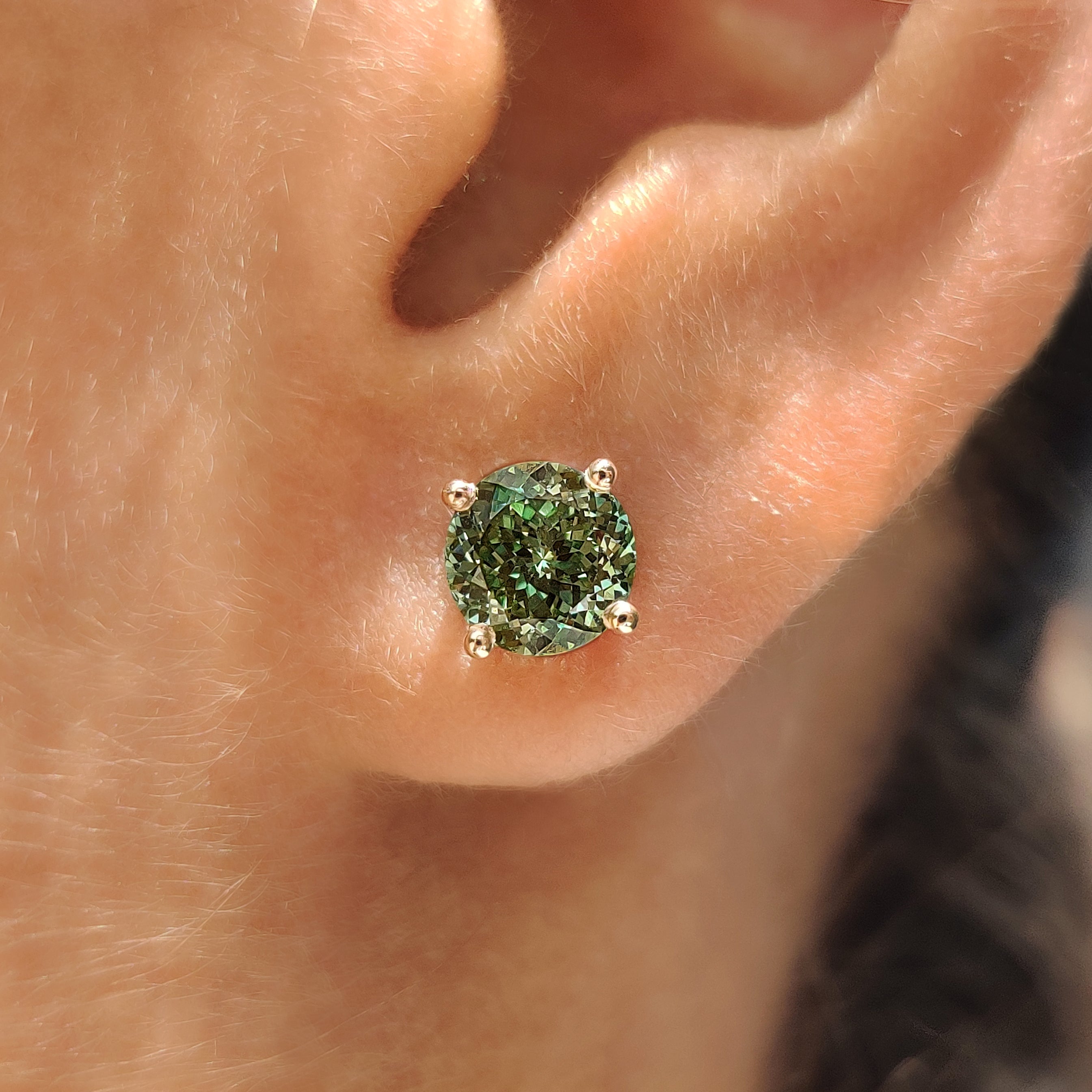 Portuguese cut green diamond earrings in stud style design
