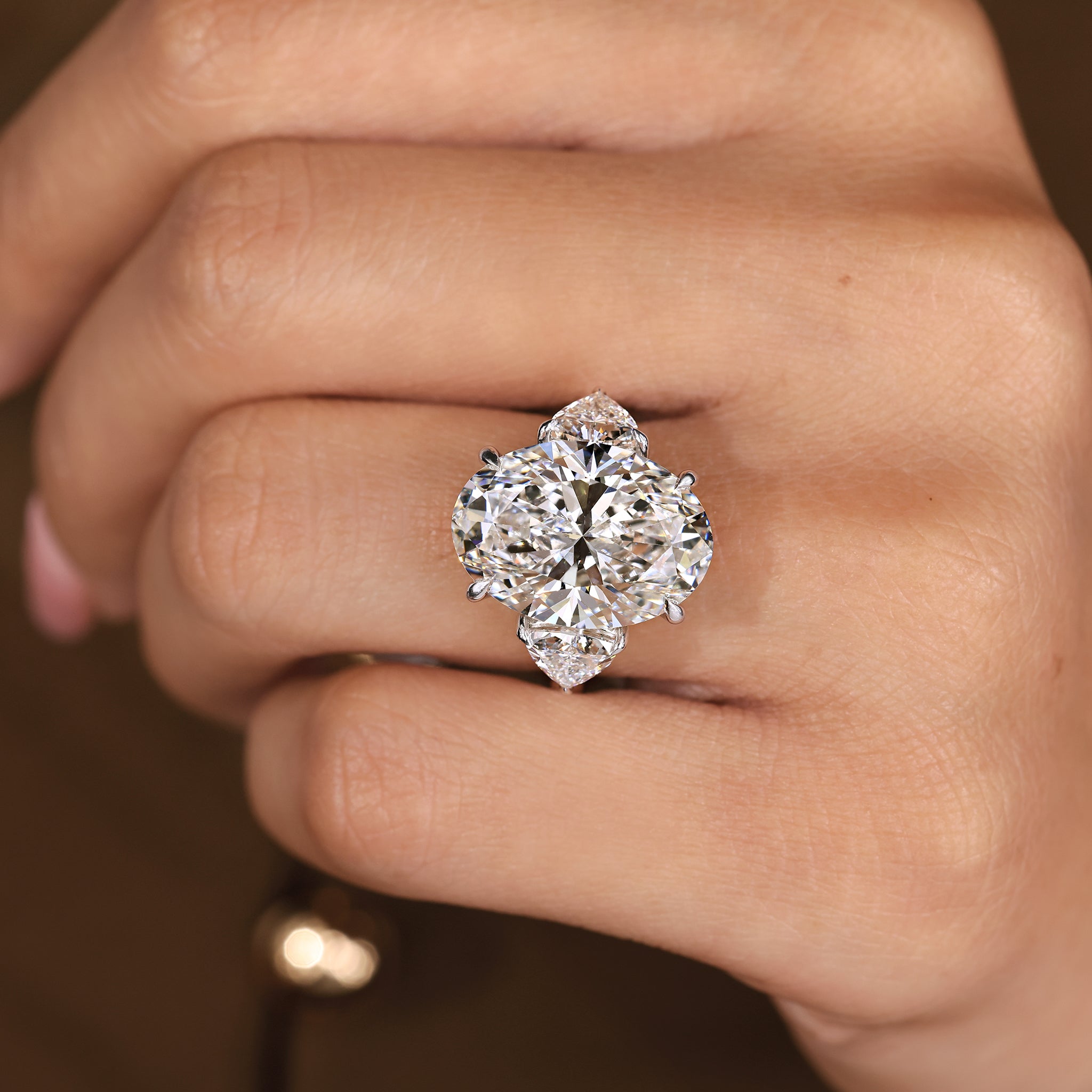 IGI Certified 10 -15 Carat Oval Diamond Ring in Three Stone Style