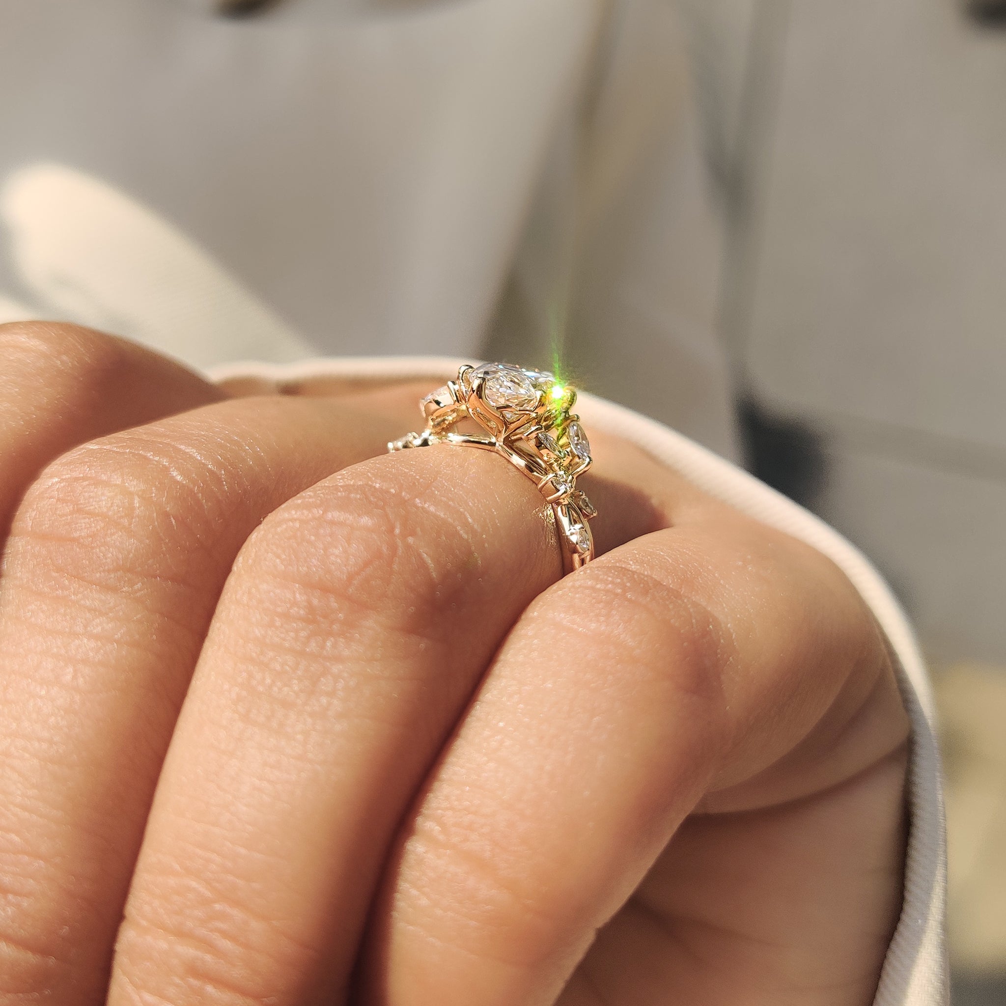 Marquise center ring with twisted band and side stones.
