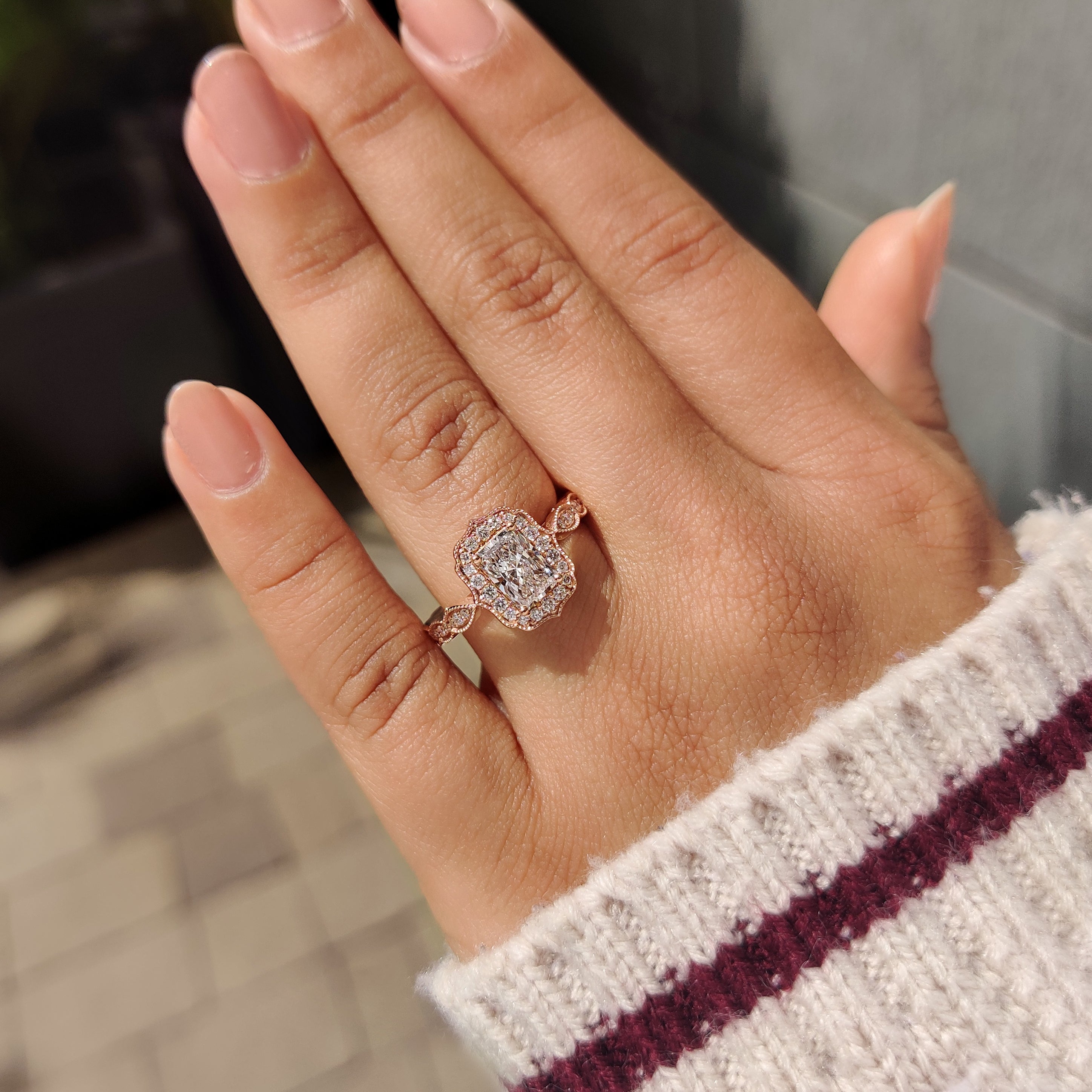 Vintage style radiant diamond ring with pave accents.
