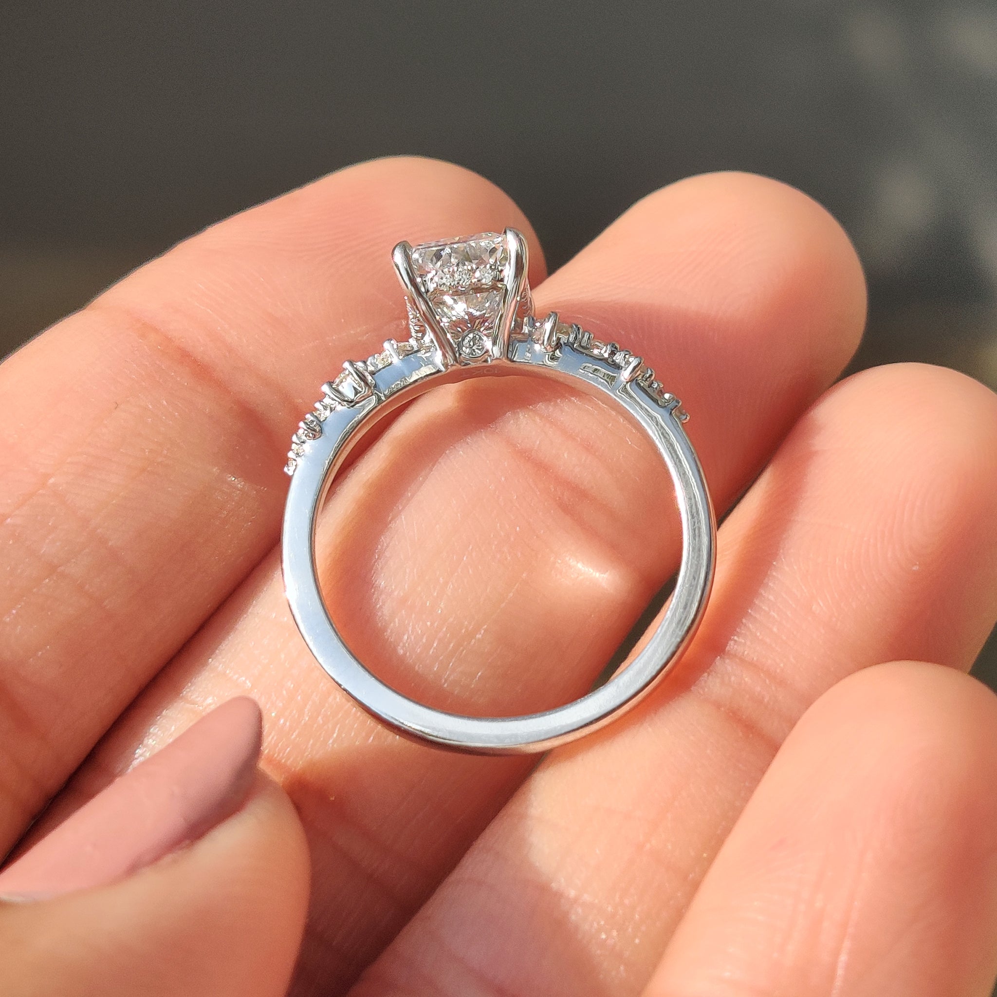 Radiant cut diamond ring designed with hidden halo details.
