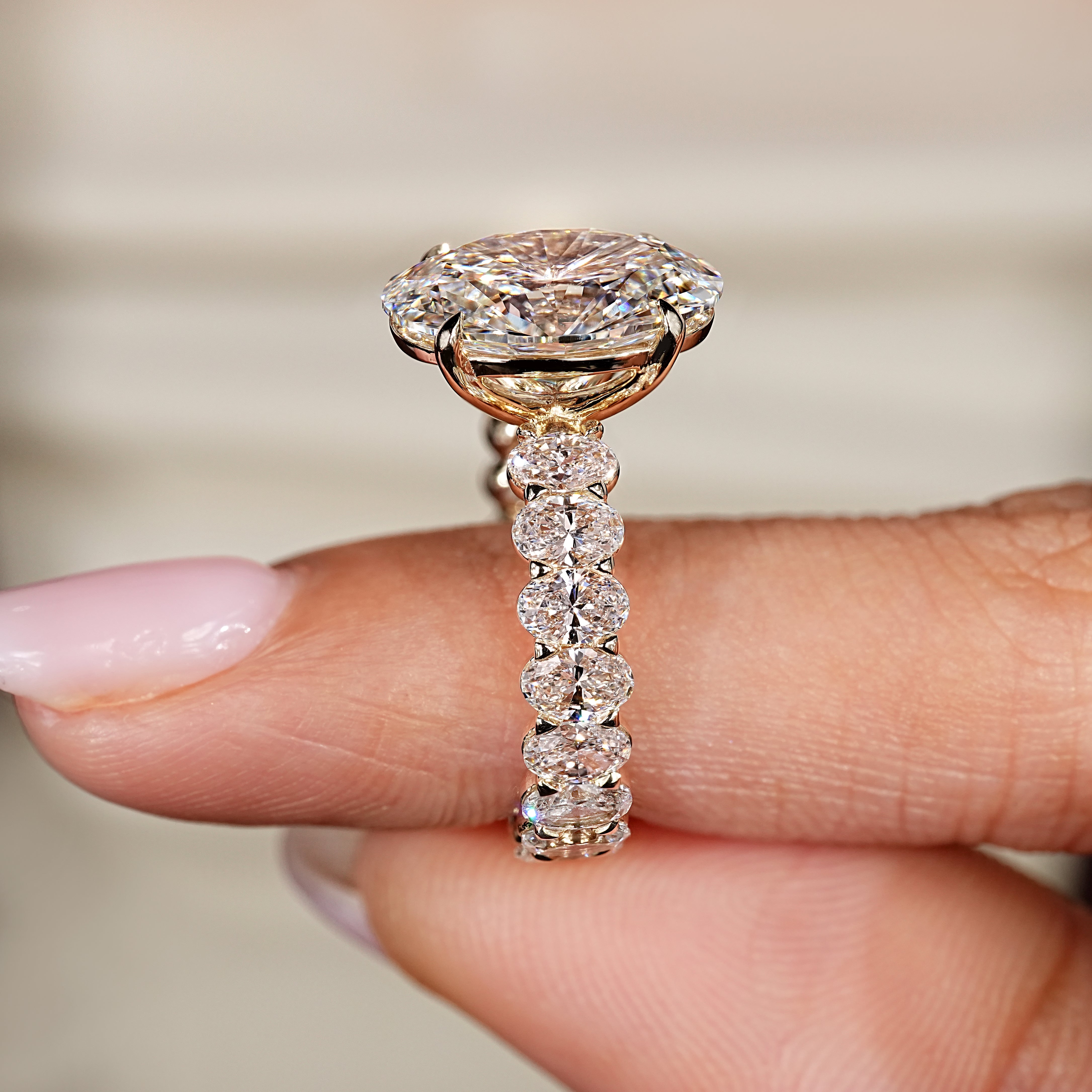 Oval ring with four claw prong setting

