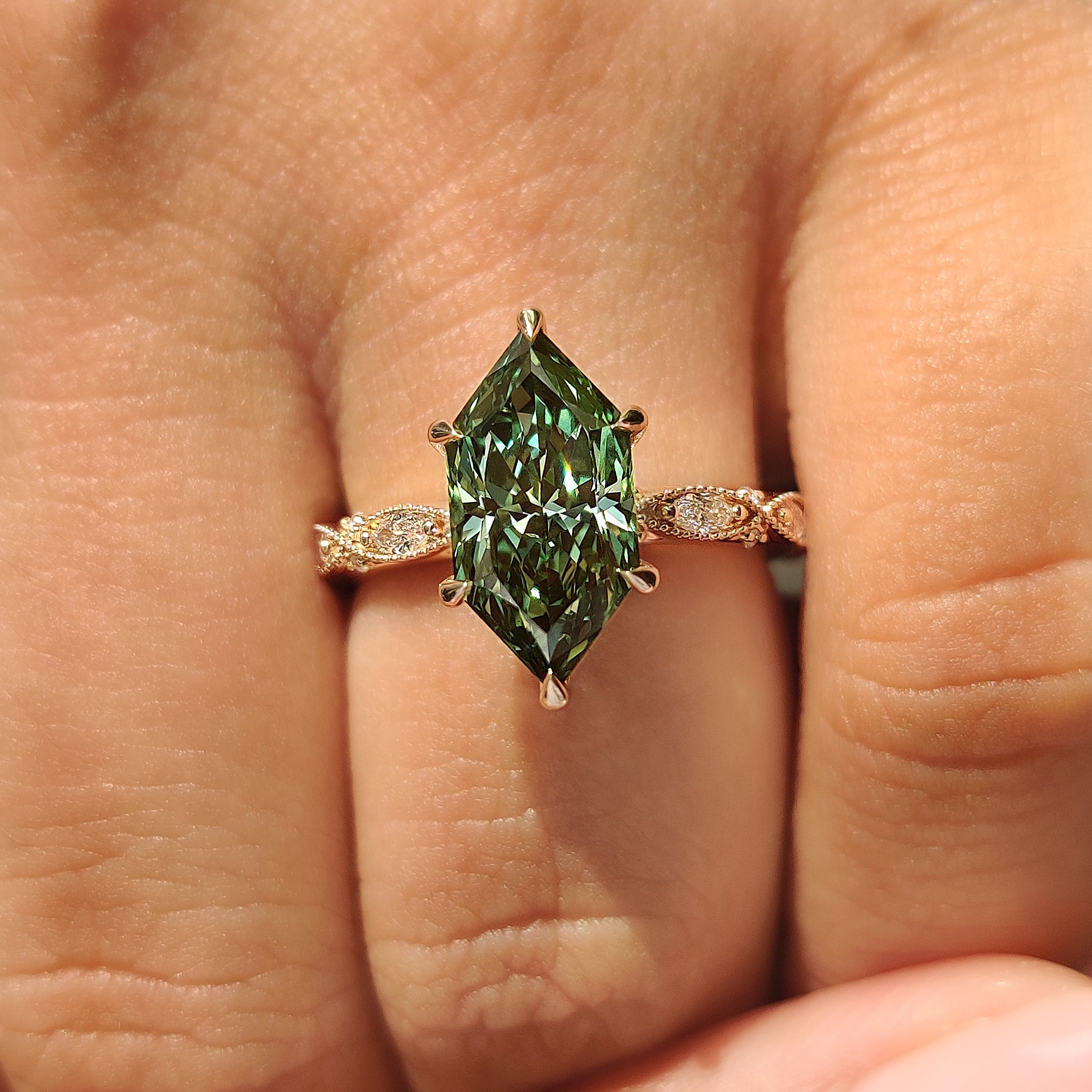 Green Dutch marquise ring with milgrain details
