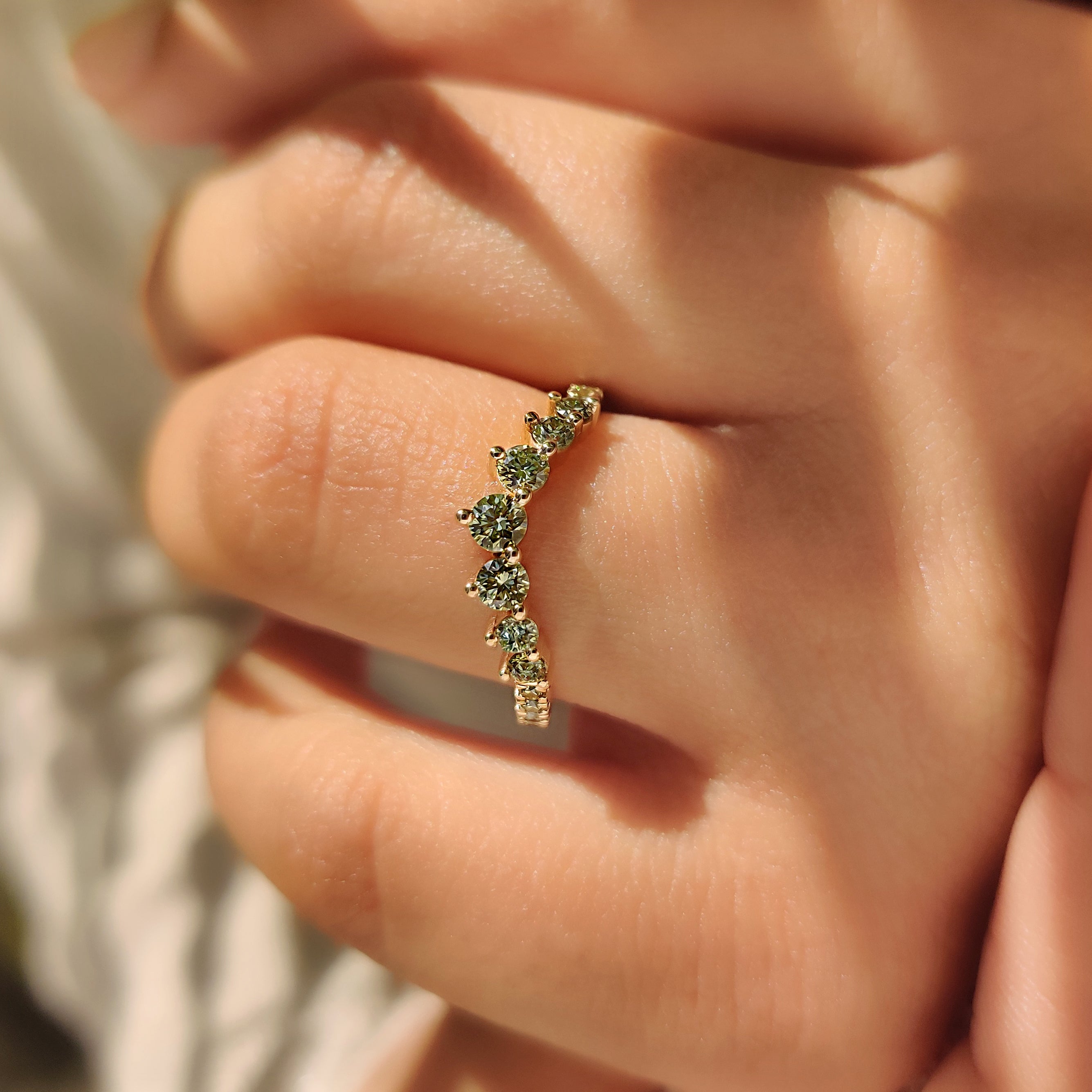 Handmade half eternity band with shared prong diamond setting
