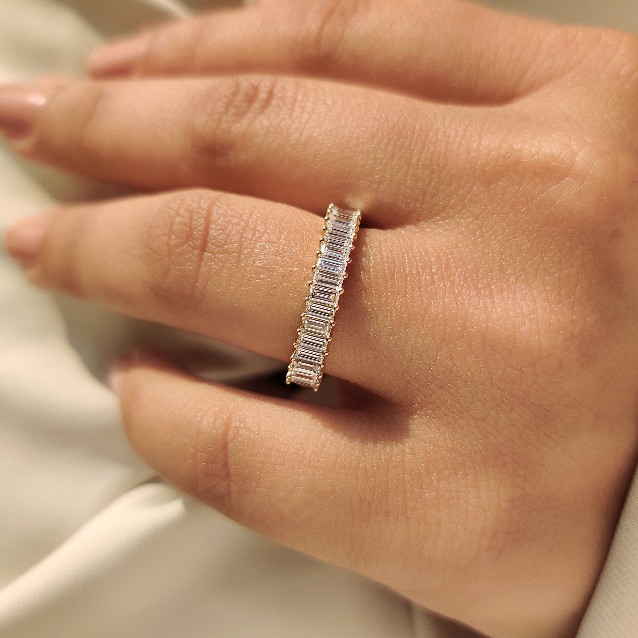 Lab grown baguette diamond band with classic prong setting.
