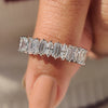 Half eternity band with baguette and oval diamond design
