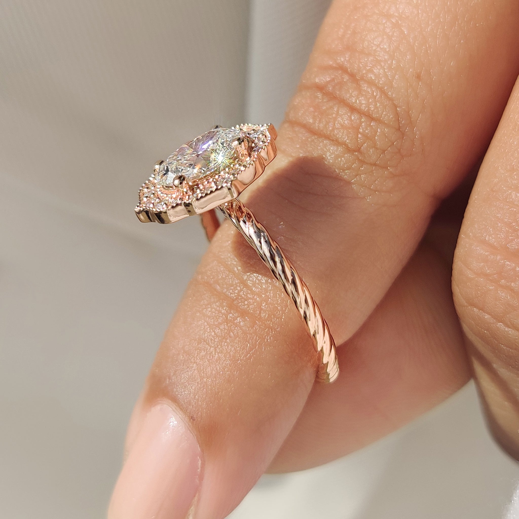 Four prong setting oval diamond engagement ring.
