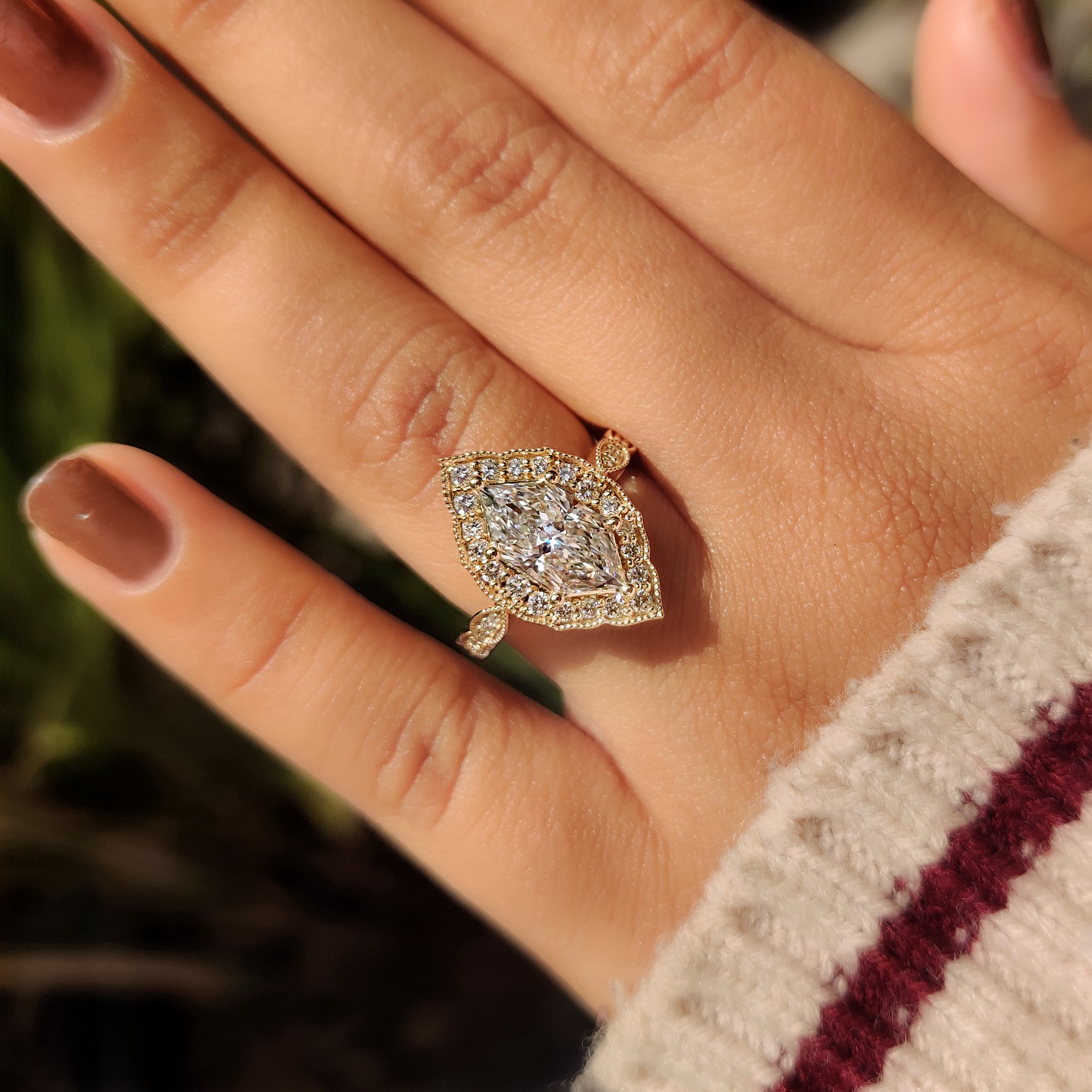 Vintage style ring with dutch marquise and round accents.
