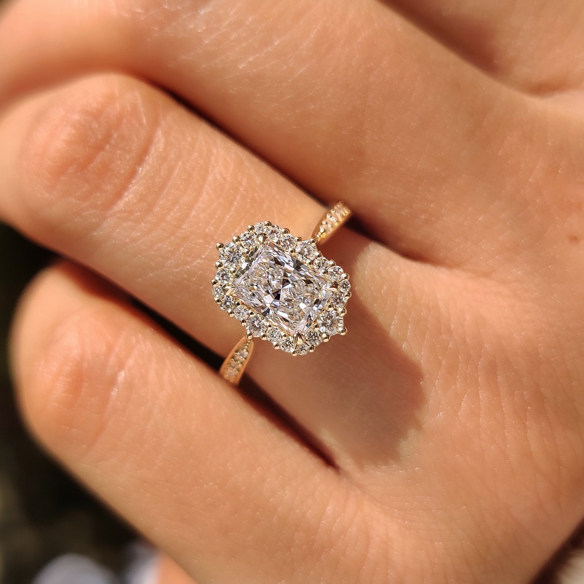 Lab grown radiant diamond ring with round pave band.
