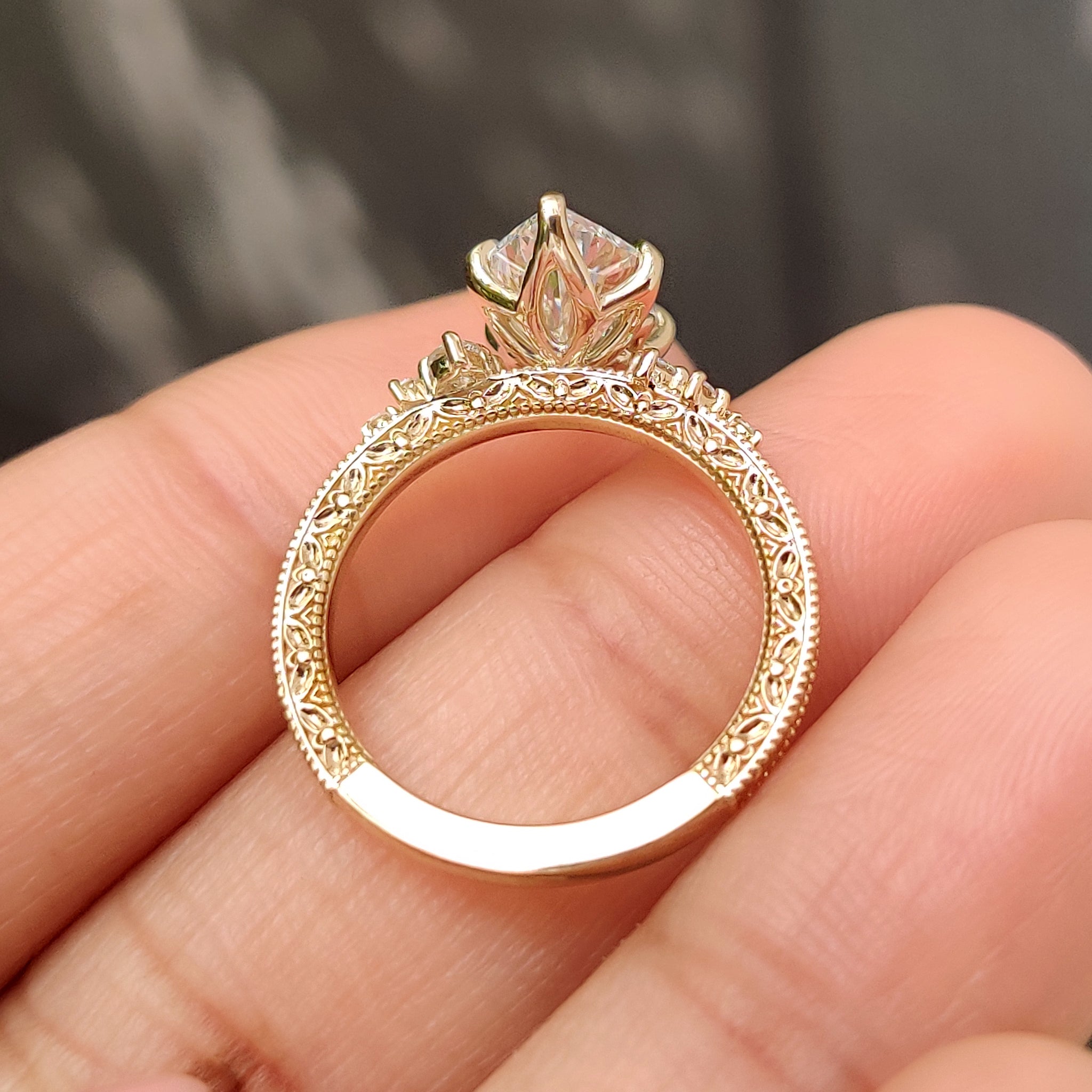 Tulip setting marquise diamond ring with floral details
