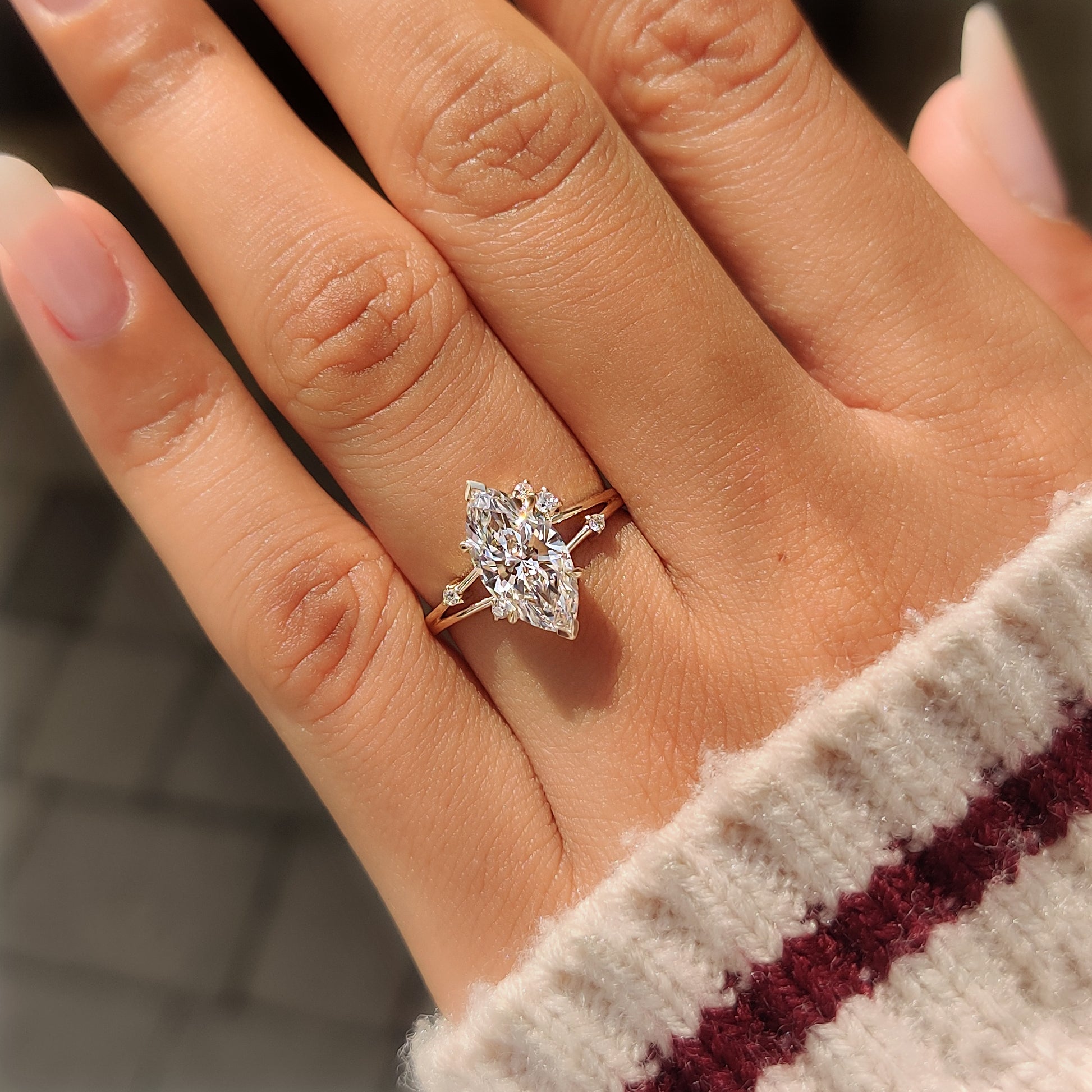Yellow gold split shank ring with lab grown marquise diamond.
