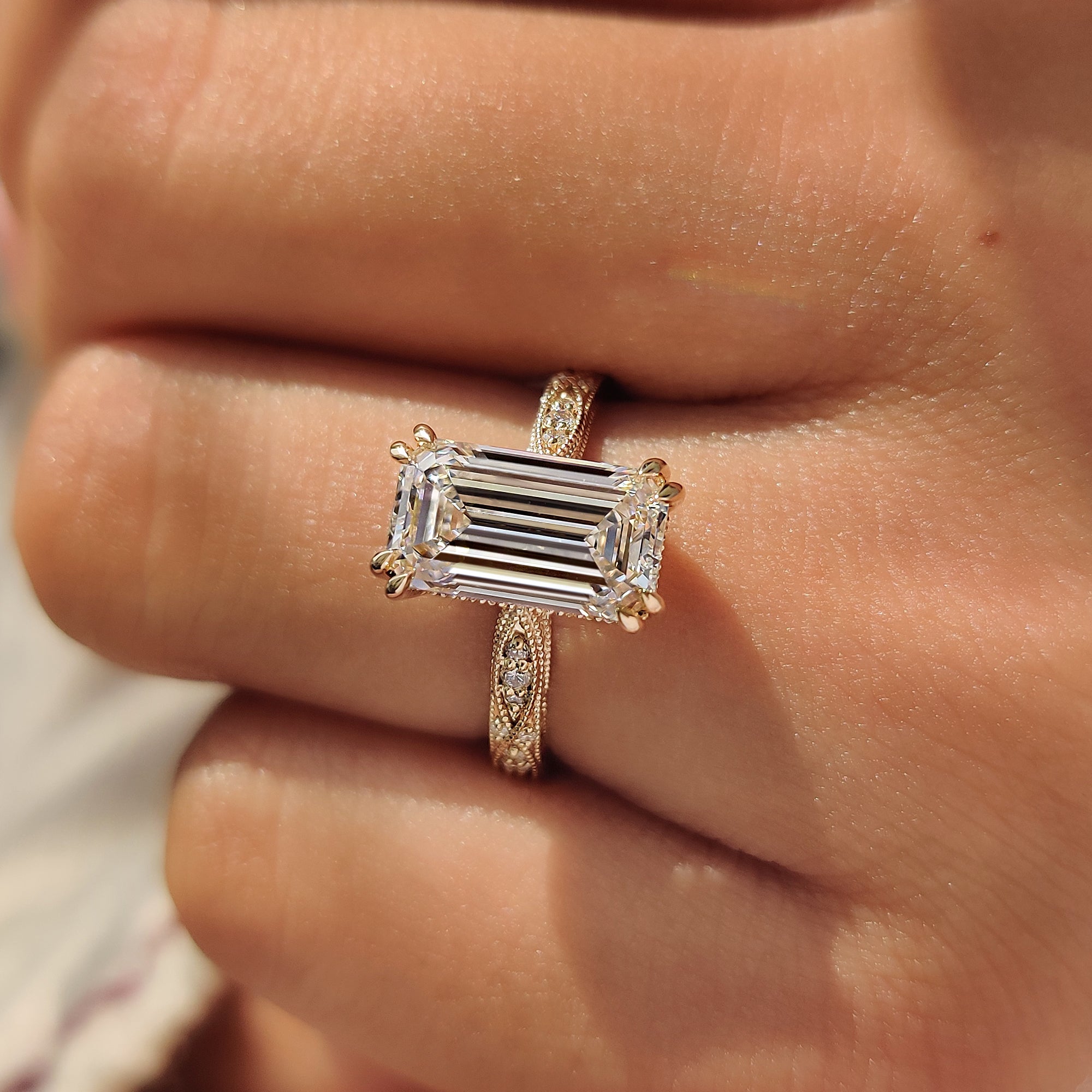 Milgrain detail on vintage emerald diamond ring.
