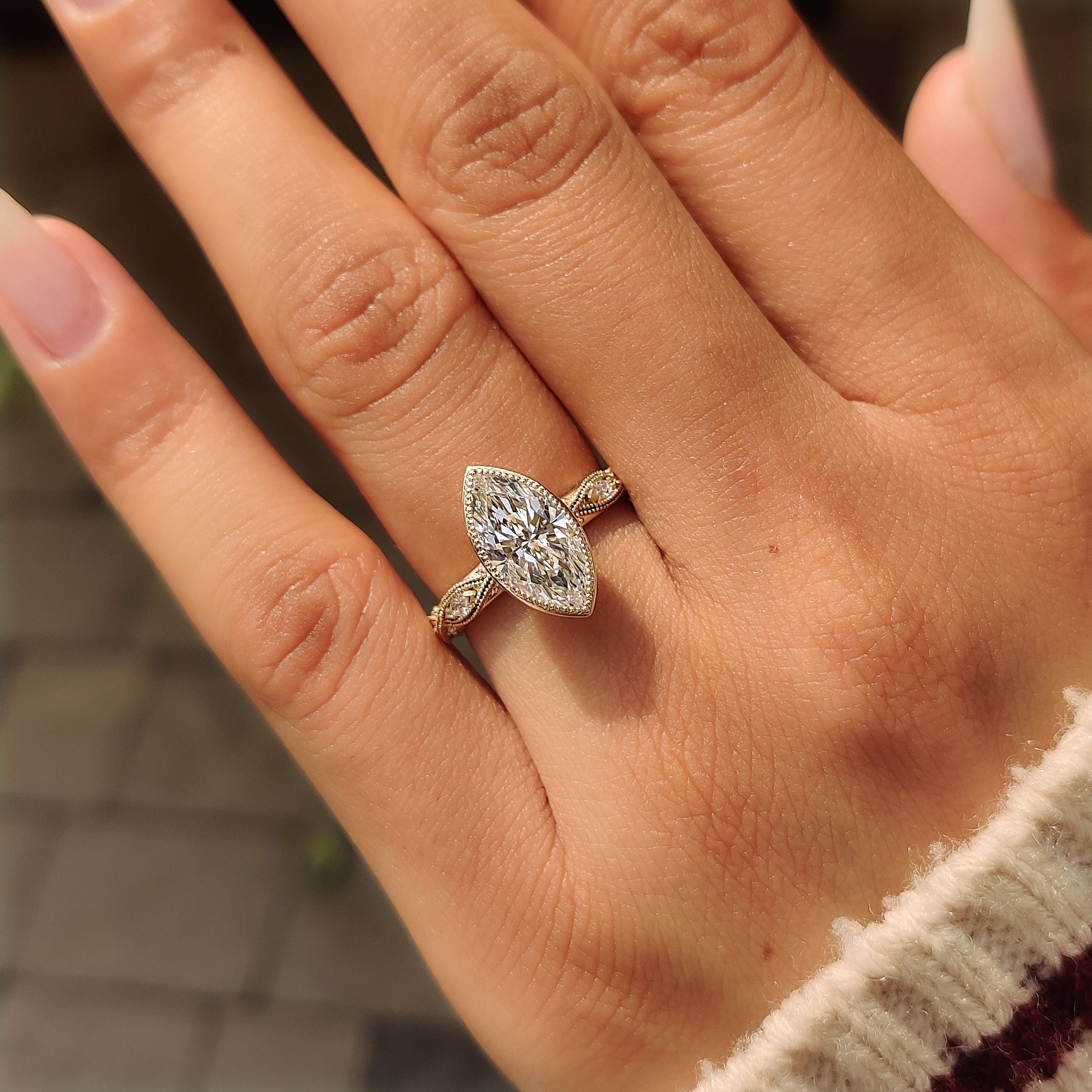 Vintage inspired bezel engagement ring with milgrain edges.
