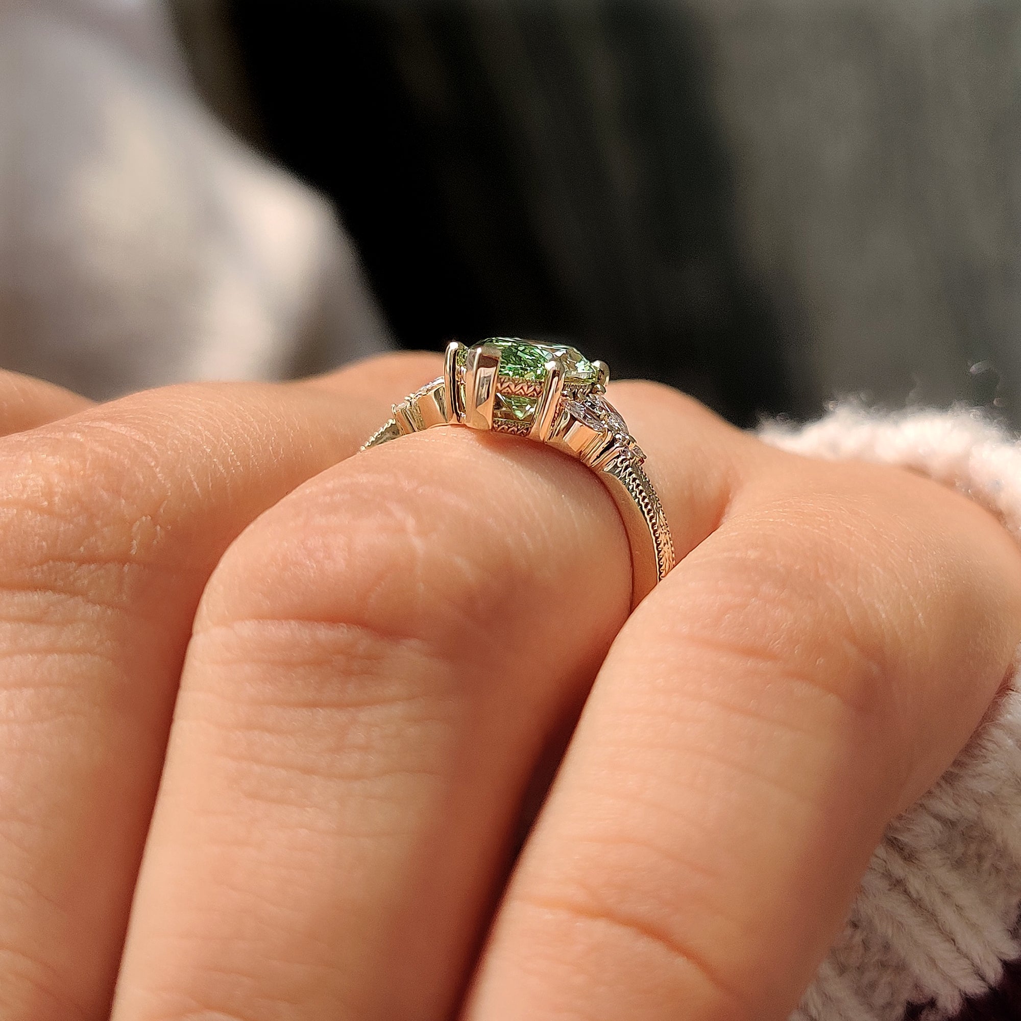 Green marquise ring with basket setting.
