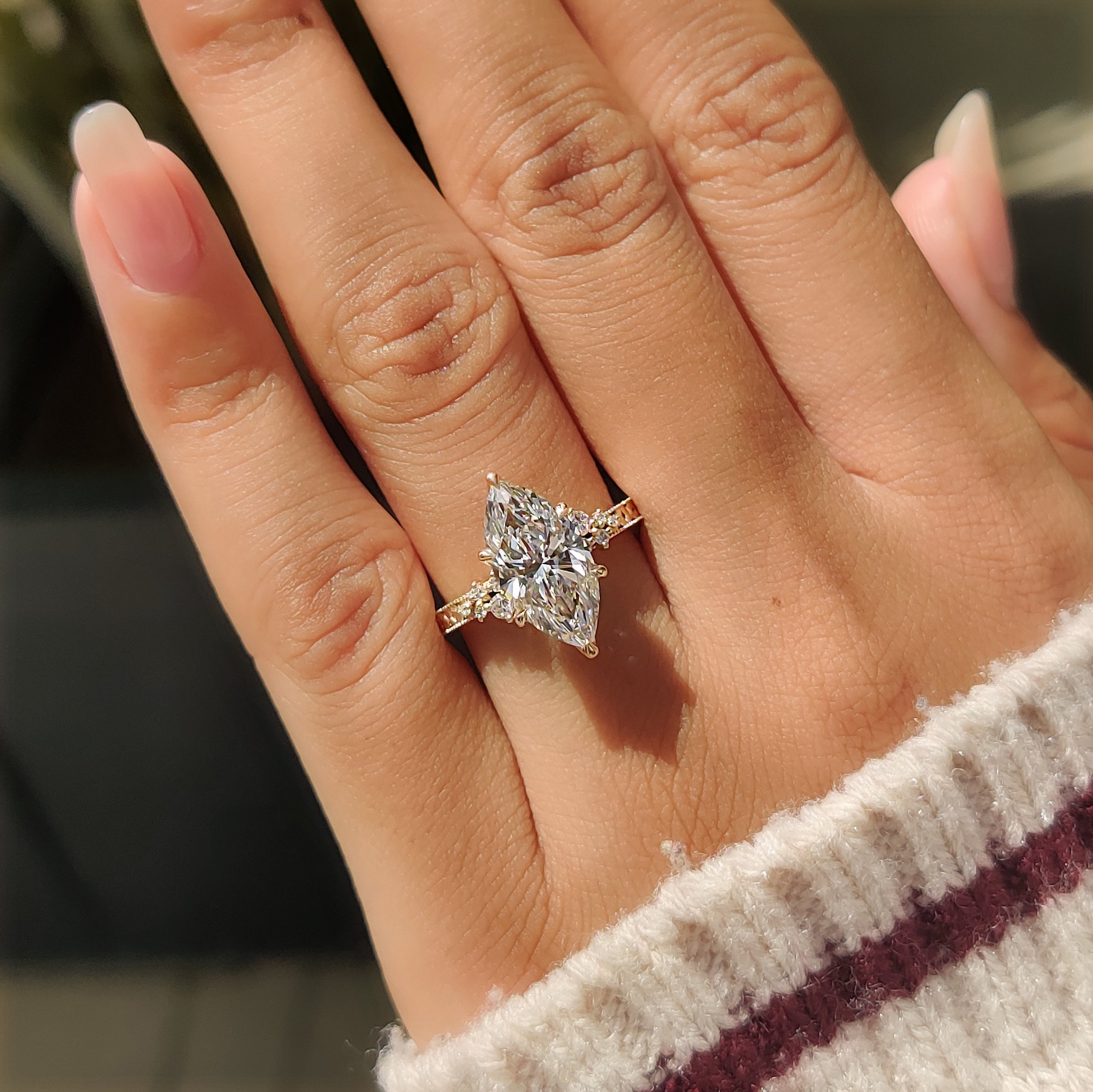 Marquise cut ring with floral and milgrain detailing
