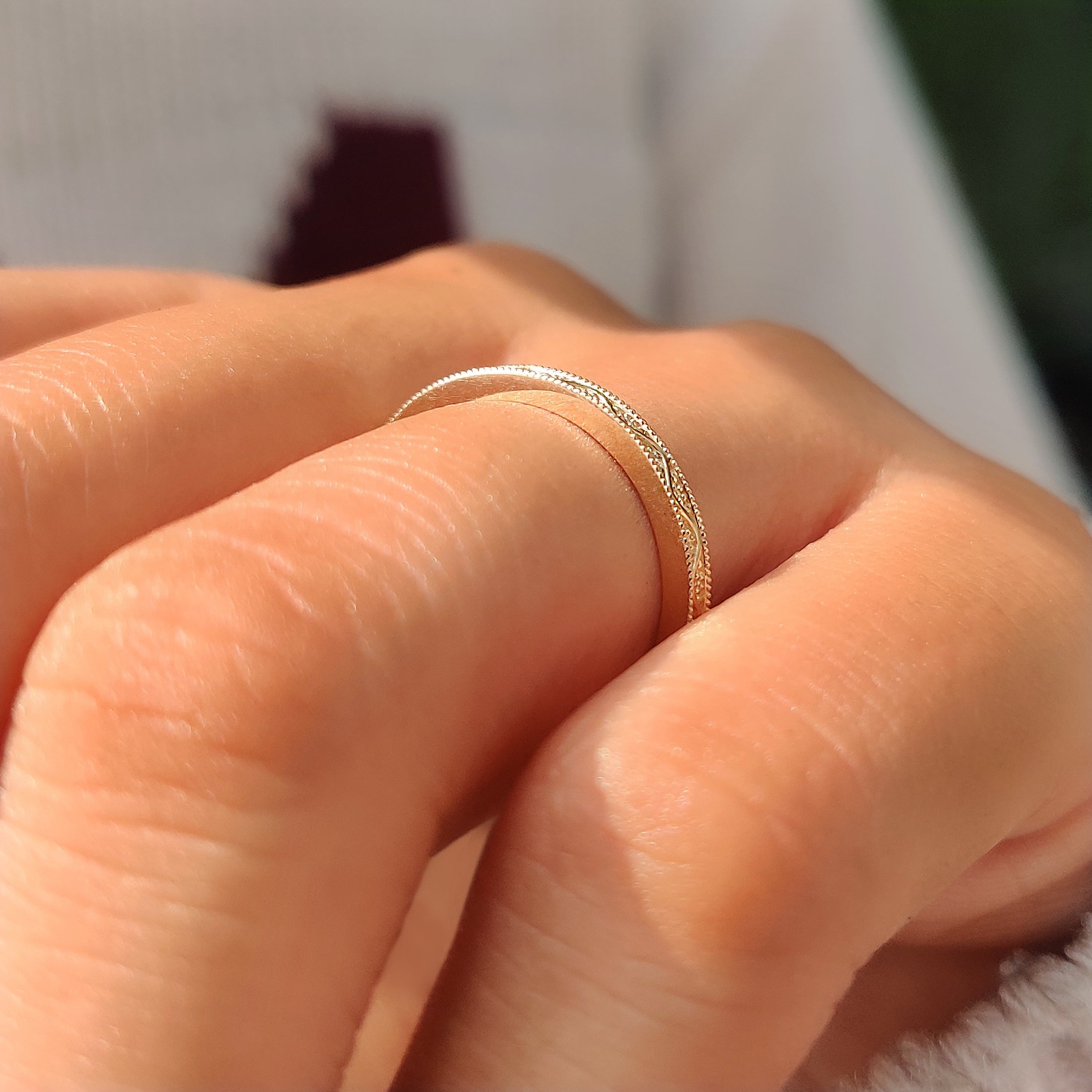 Stackable plain wedding band with milgrain details.
