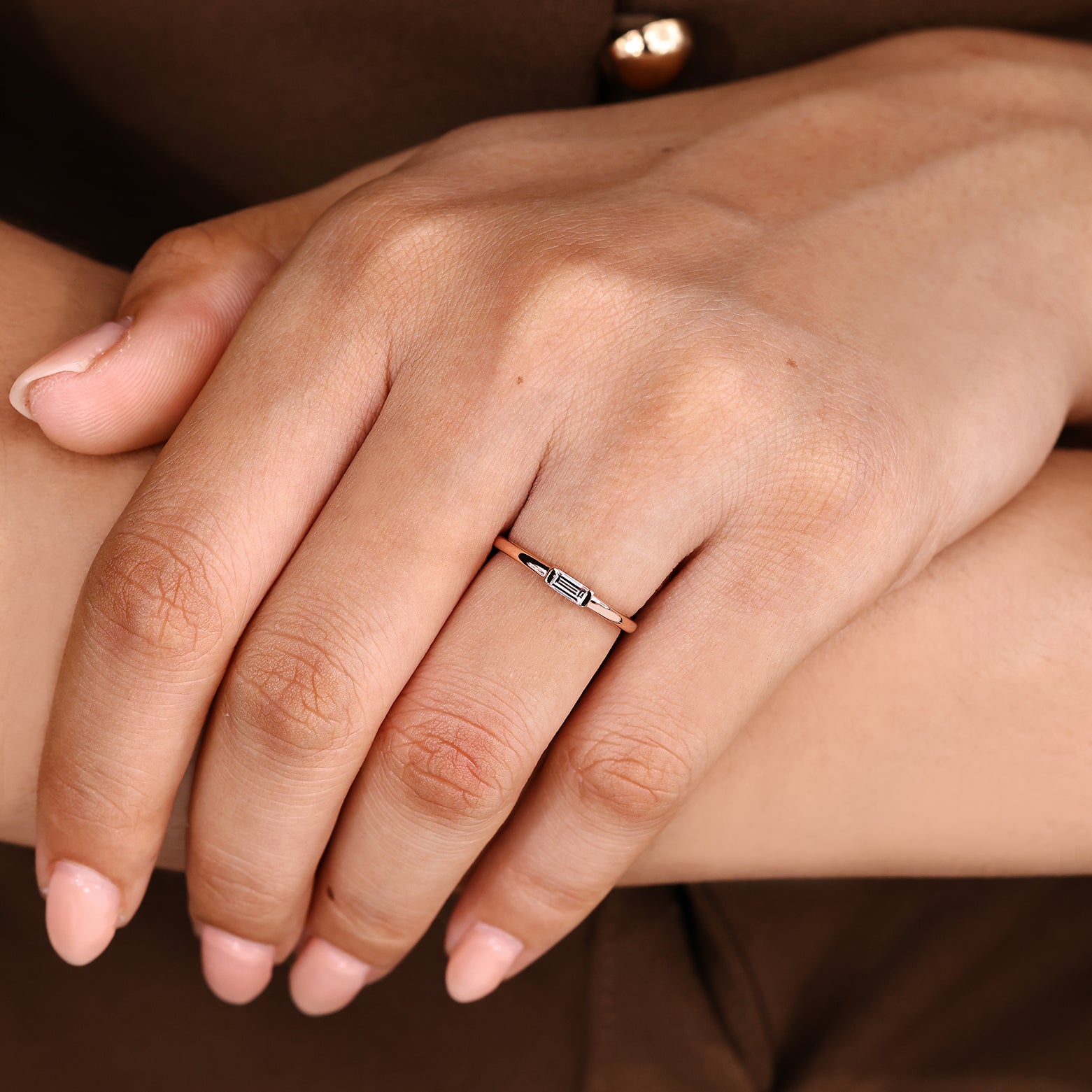 Baguette diamond wedding band with sleek half bezel style
