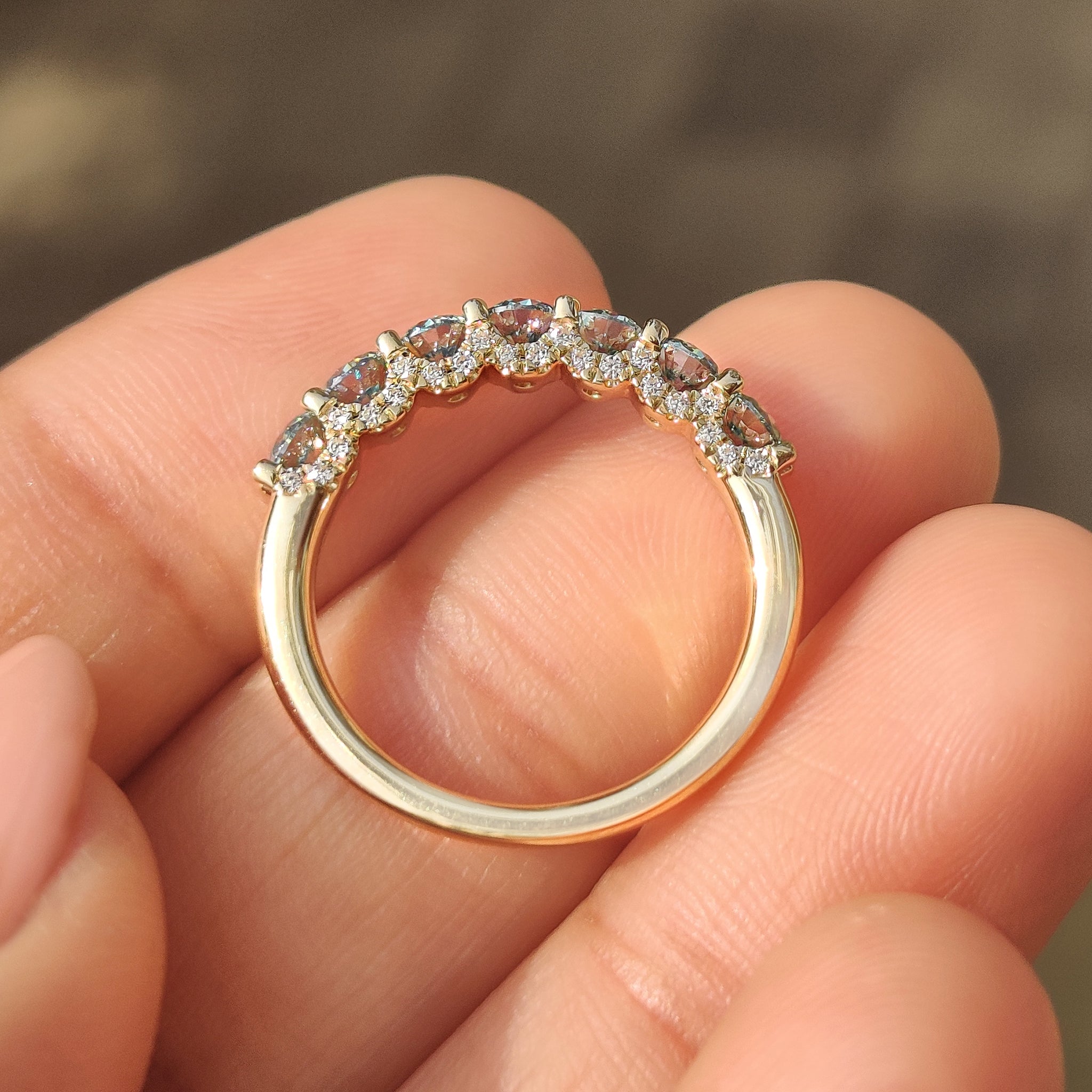 Round blue moissanite band with micro pave u prong.
