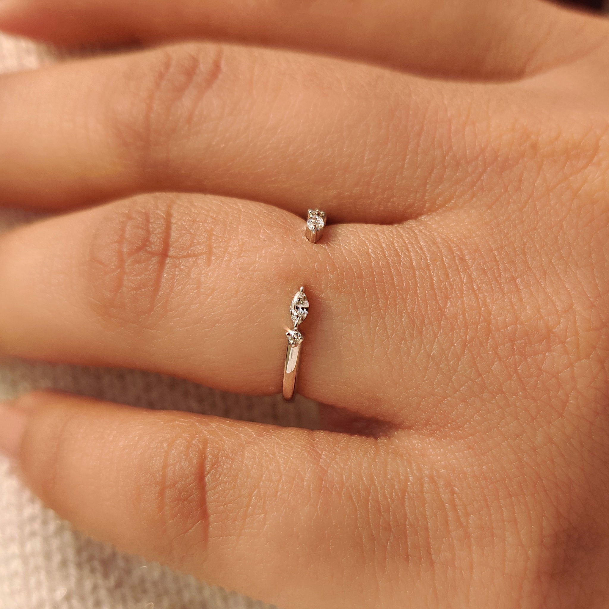 Open gap diamond band with marquise and round diamonds.
