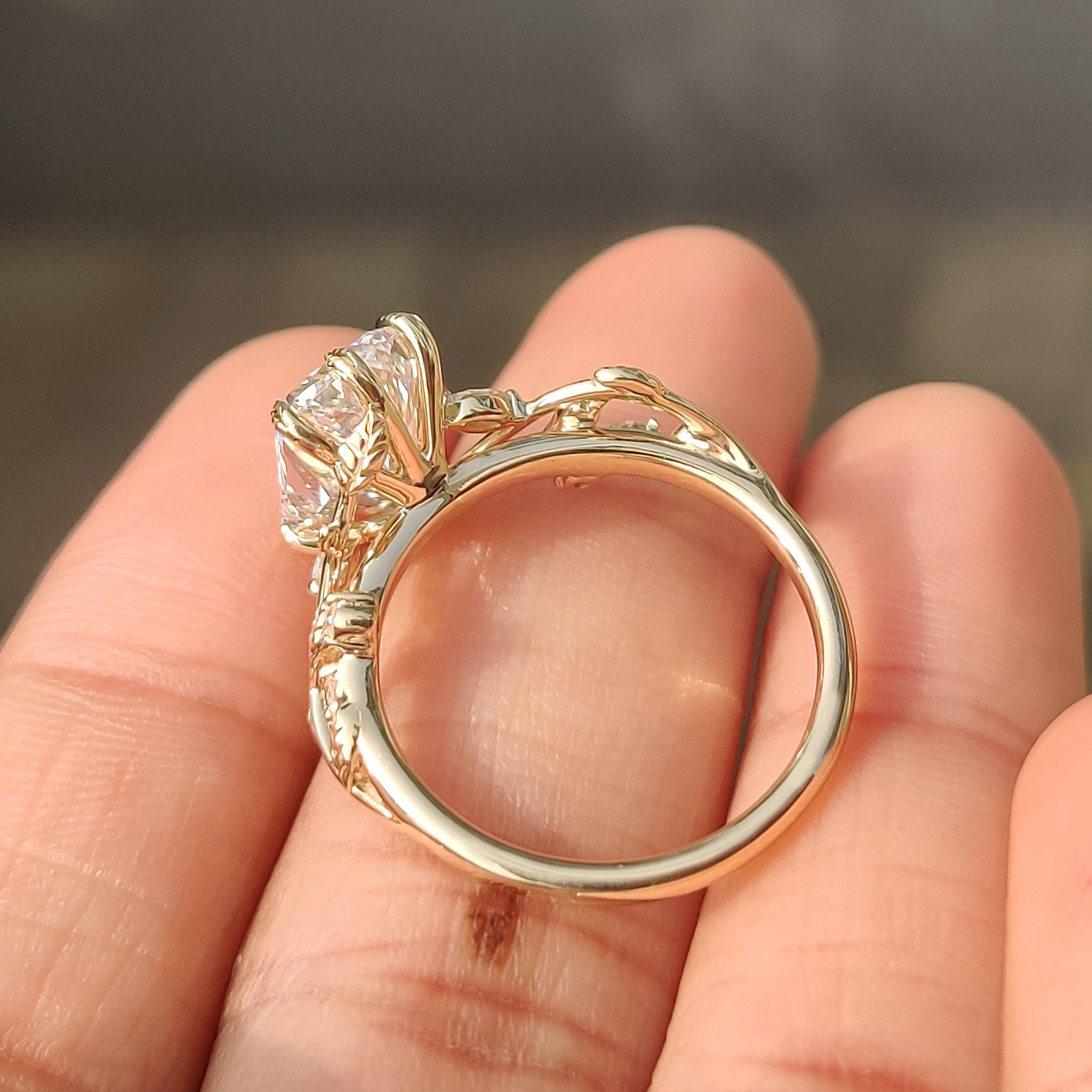 Nature inspired engagement ring with leaf style prong detail
