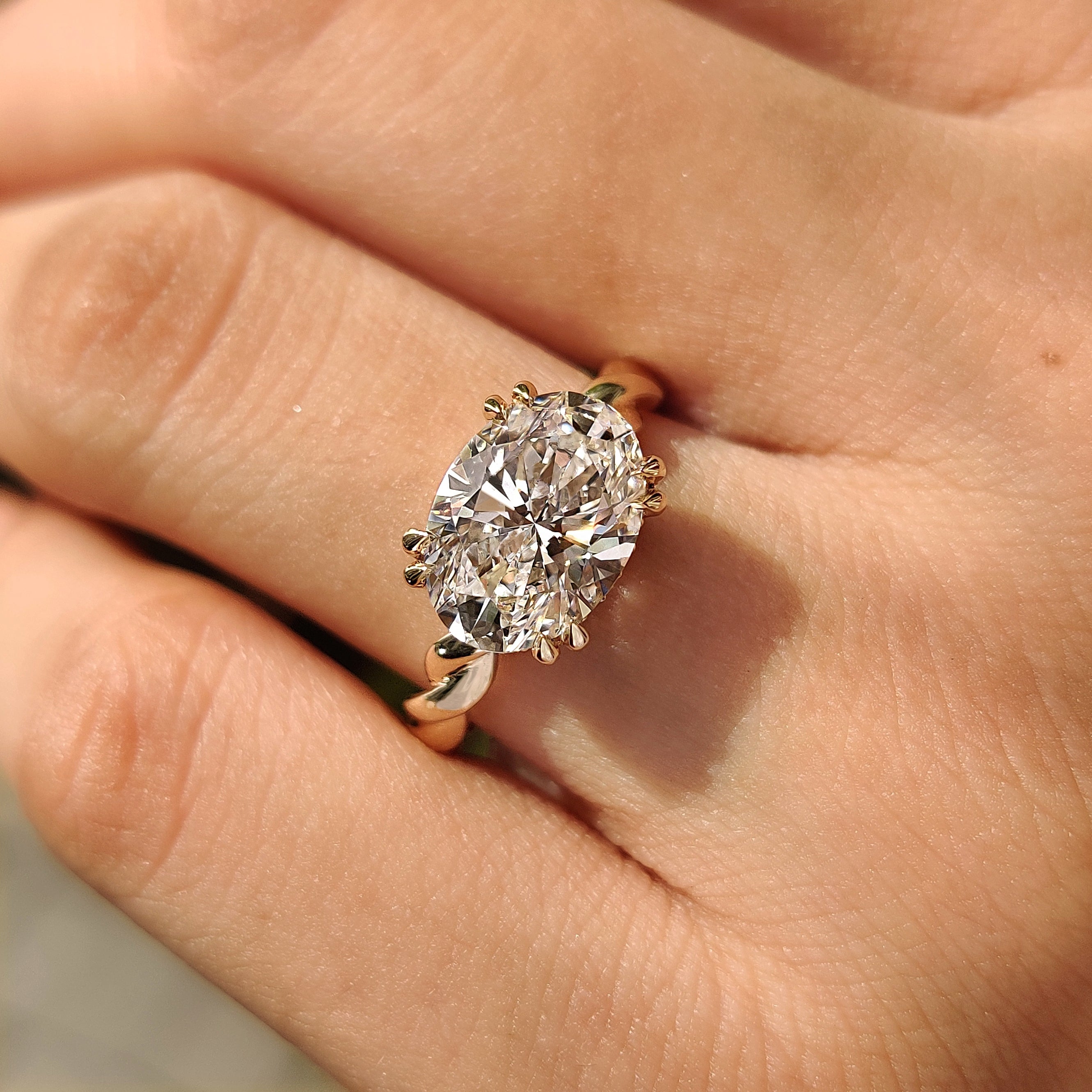 Lab grown oval engagement ring with east west orientation
