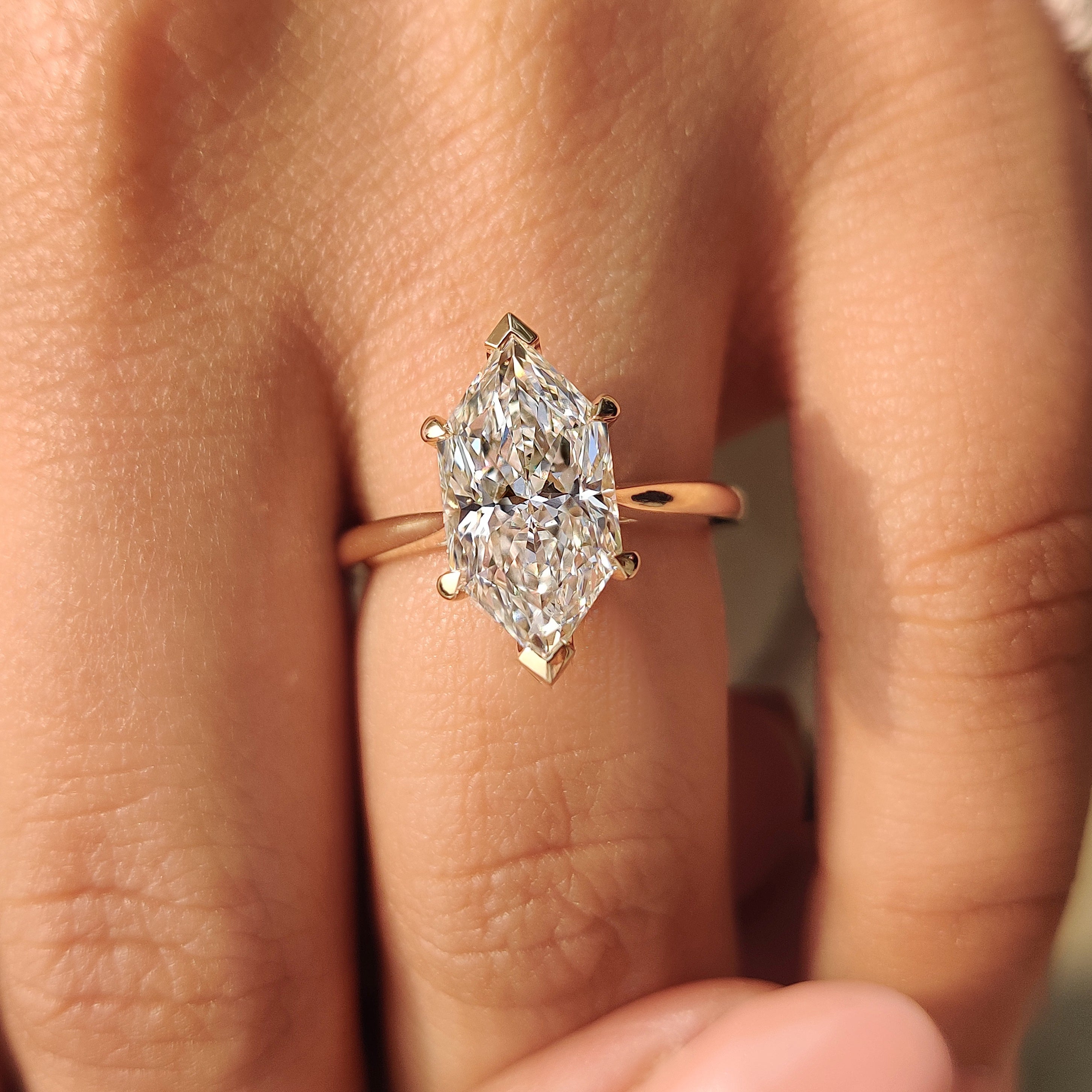 Dutch marquise diamond ring with V shape prong setting.
