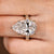 Vintage inspired pear shaped diamond ring with milgrain details
