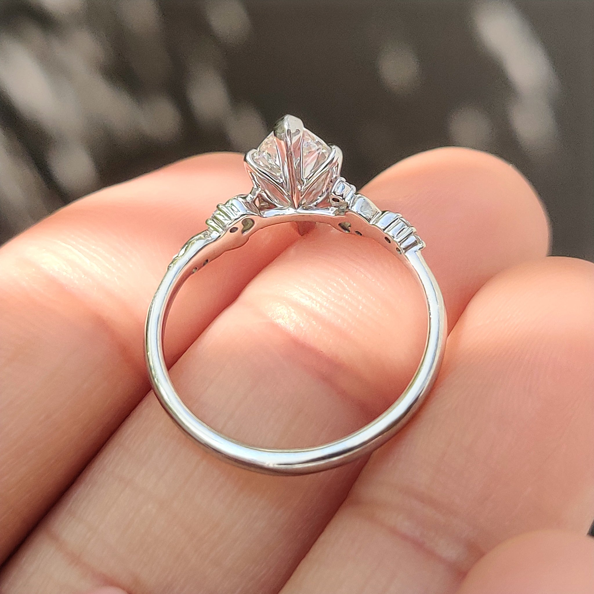 Lab grown marquise ring with round side stones accents
