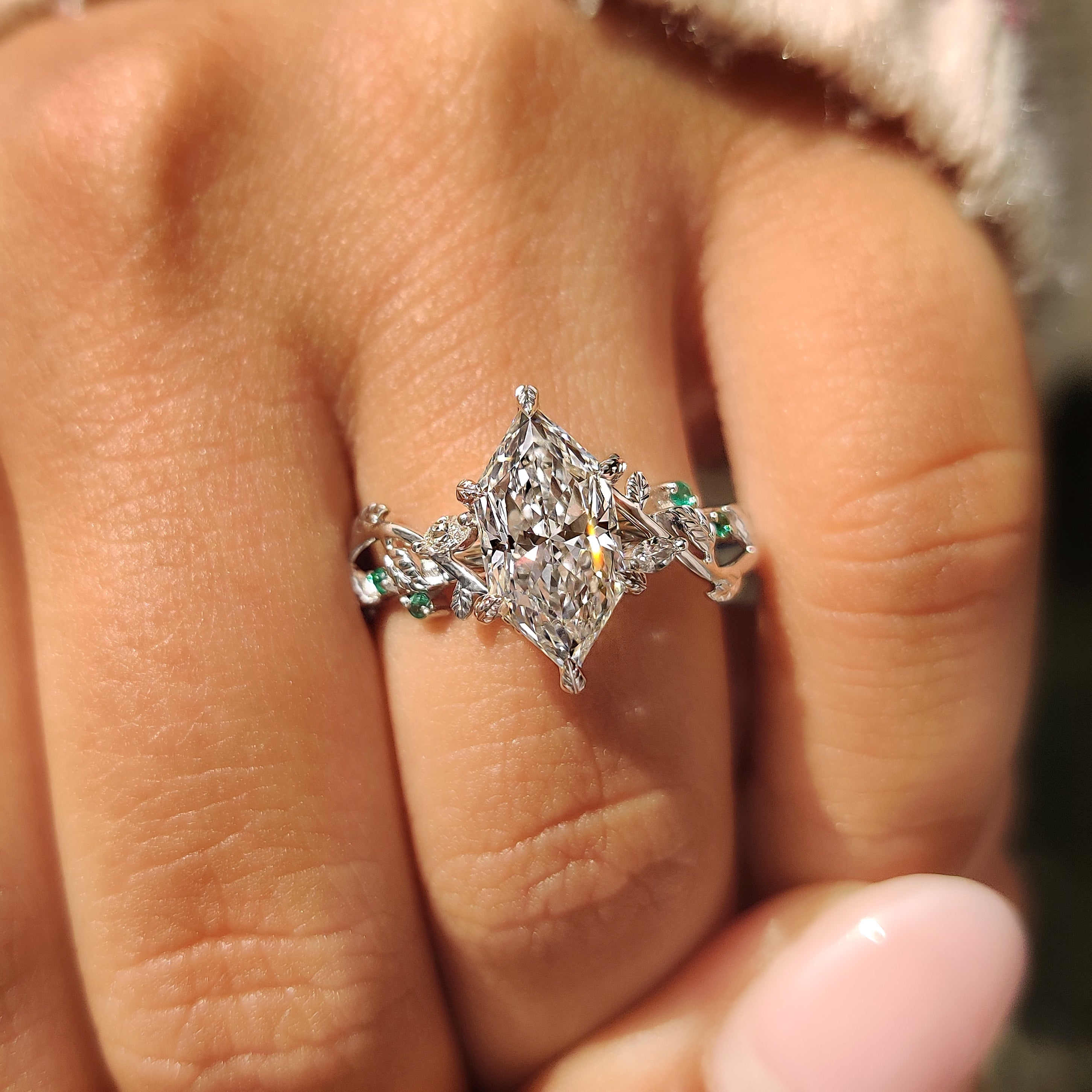 Handmade diamond ring with green gemstones and marquise accents
