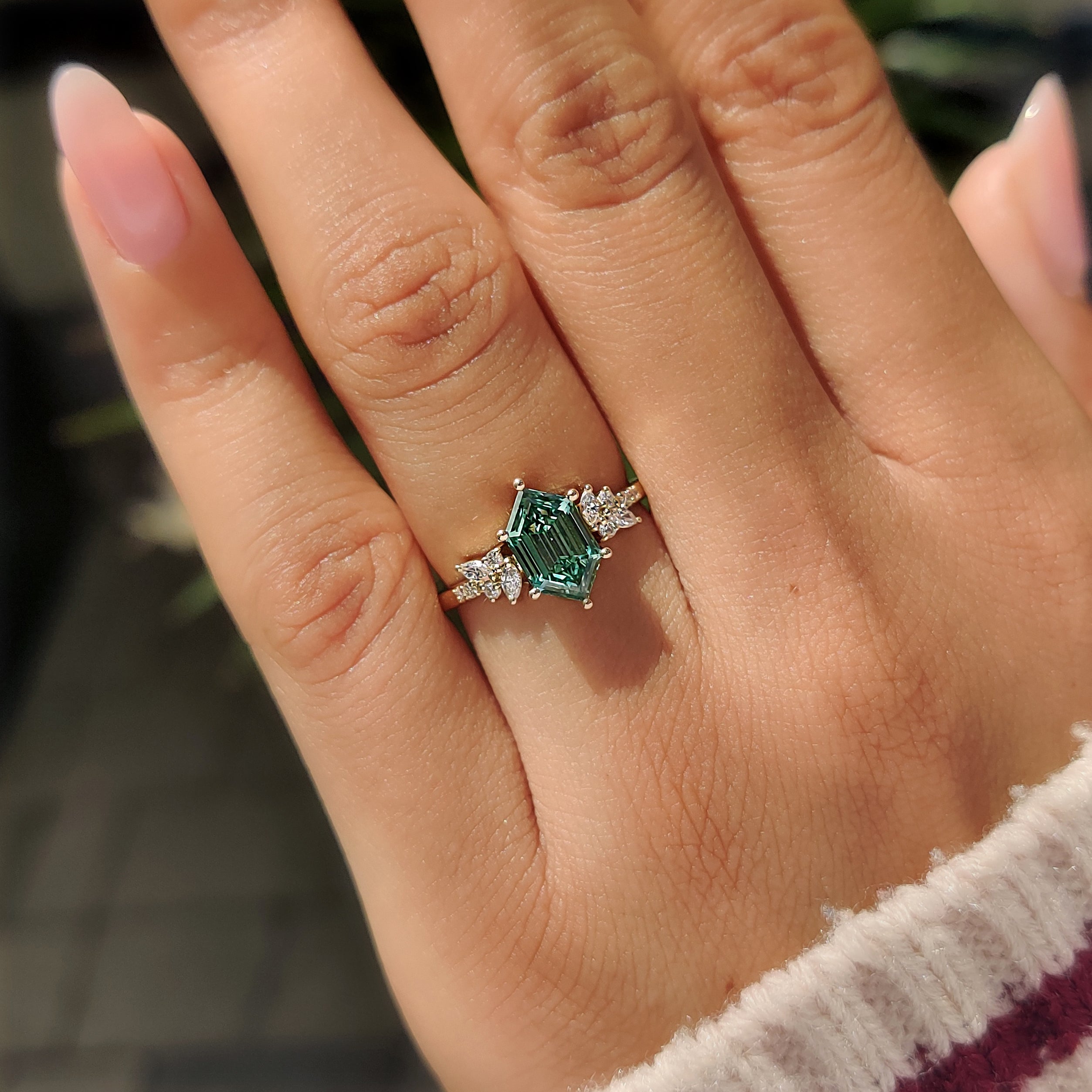 Six prong green hexagon diamond ring.
