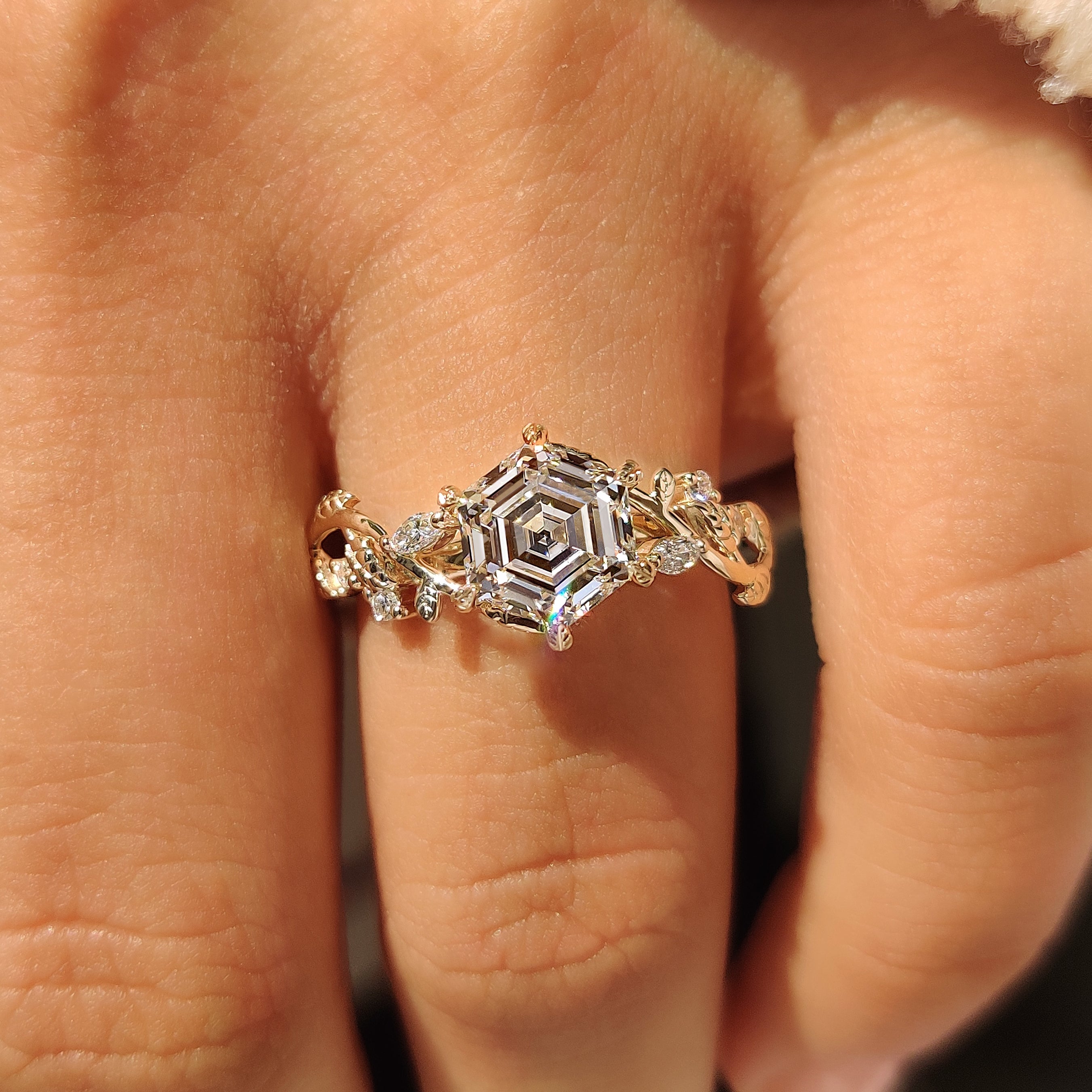 Handmade hexagon cut ring with six leaf prong setting
