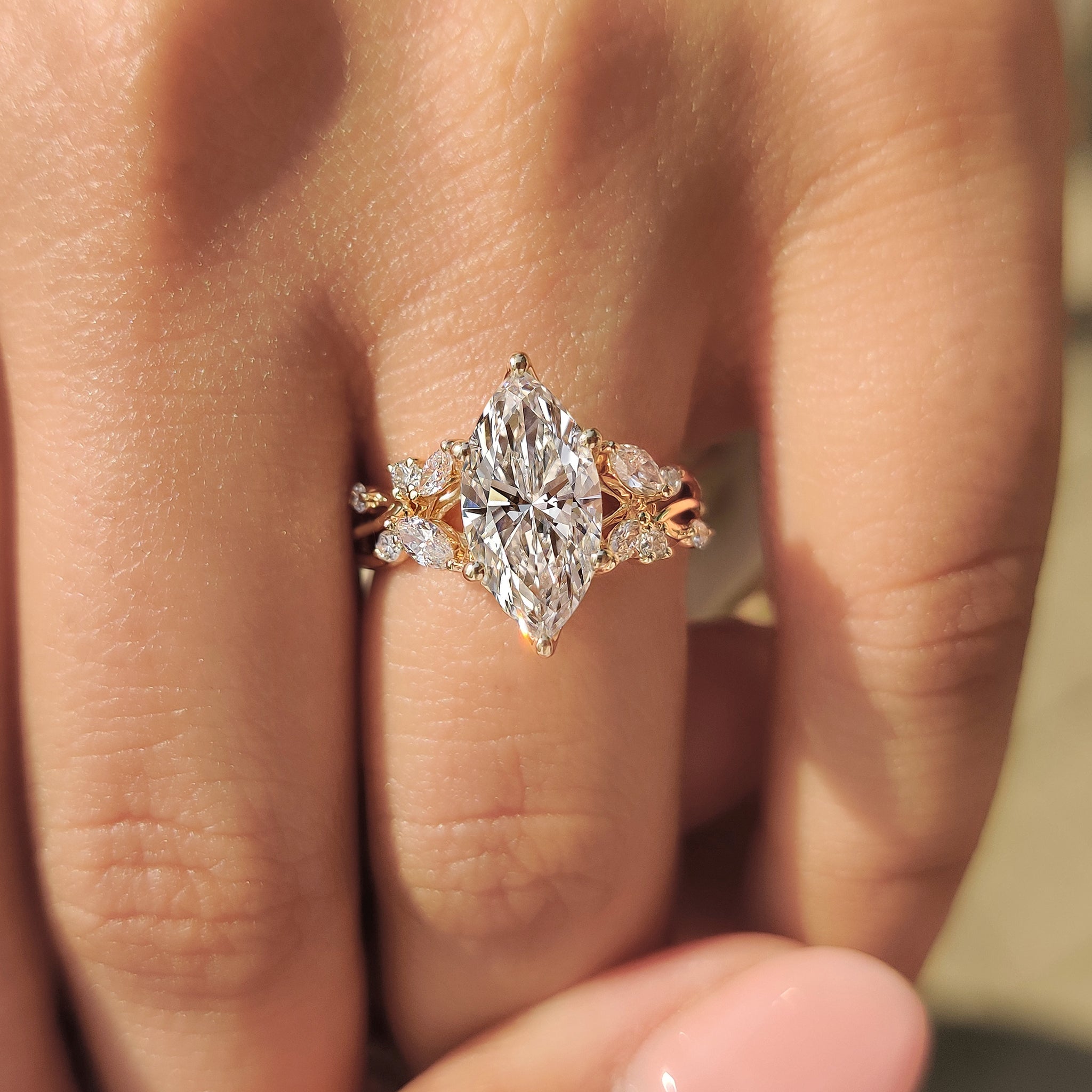Tulip prong marquise ring with round and marquise accents.
