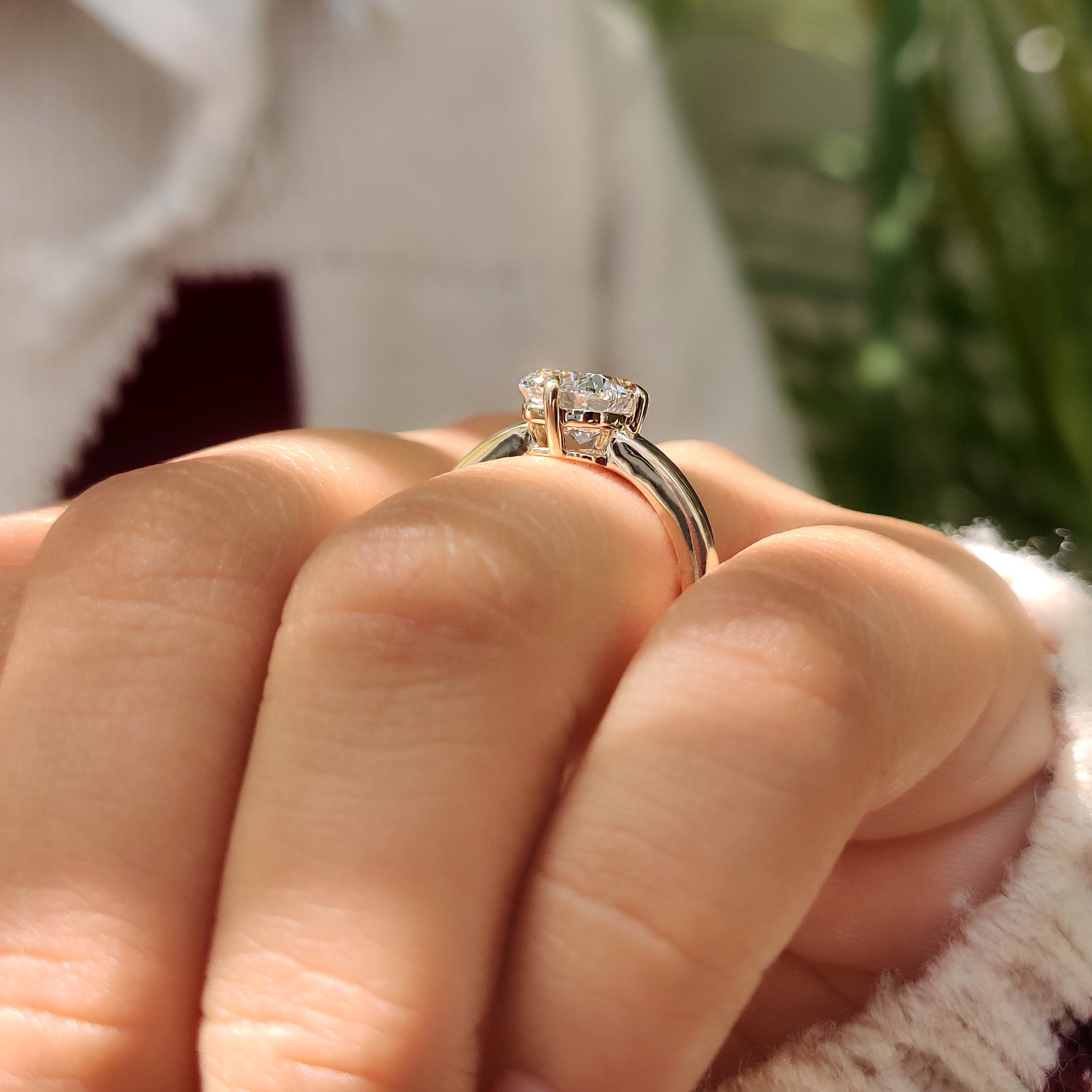 Cushion cut diamond ring with classic solitaire setting style
