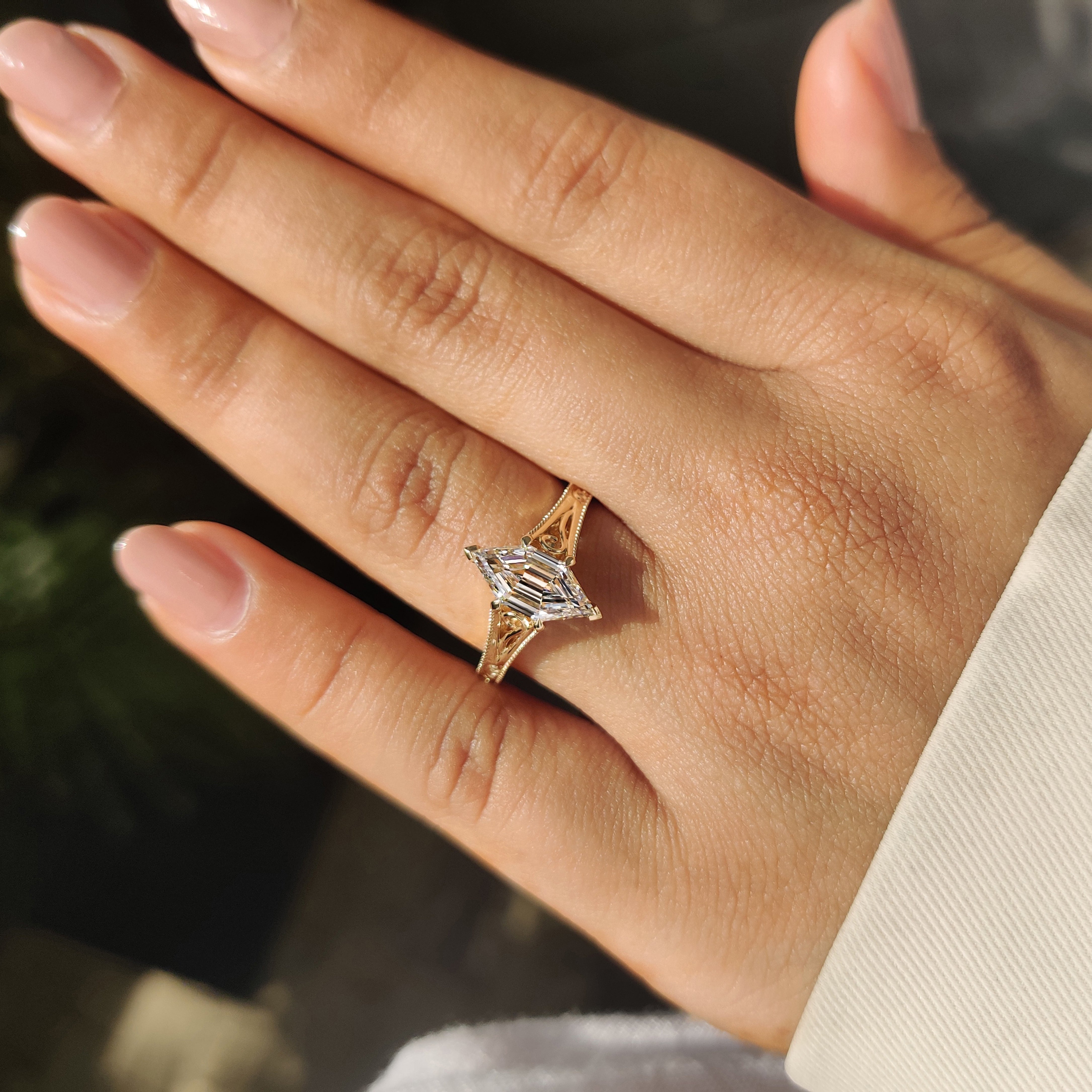 Hexagon step diamond ring with two V shape prongs
