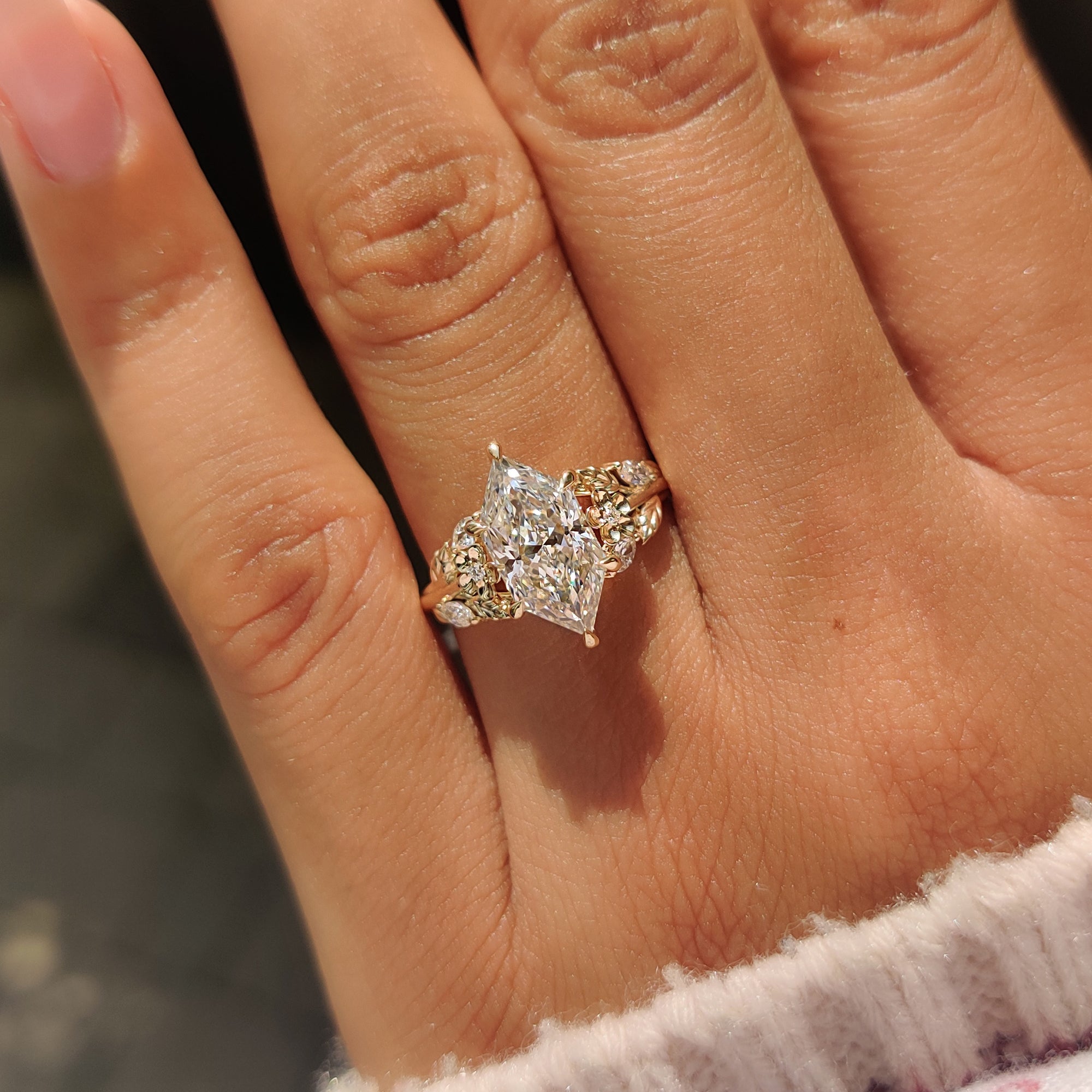 Lab grown Dutch marquise engagement ring with nature inspired design.
