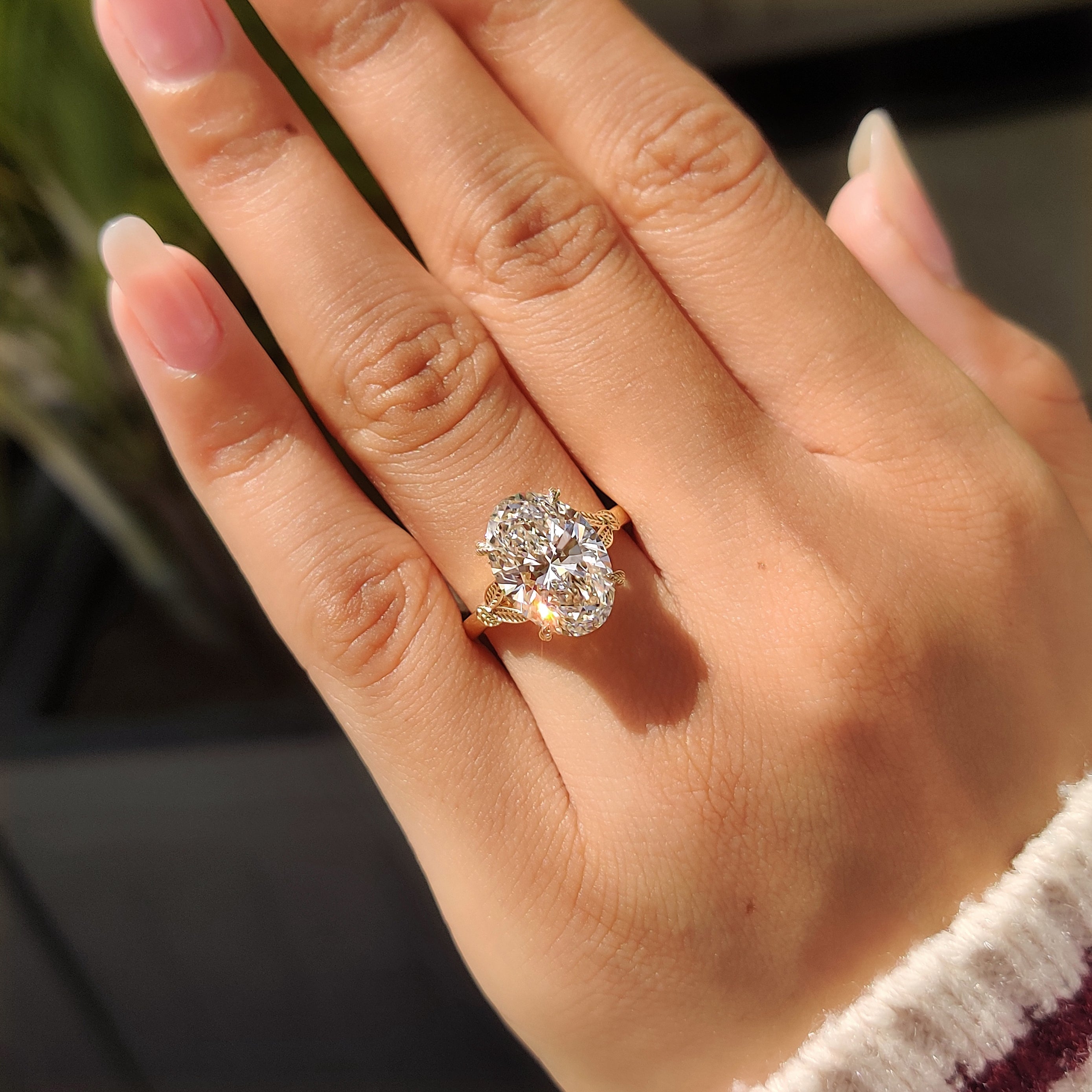 Leaf style oval diamond engagement ring

