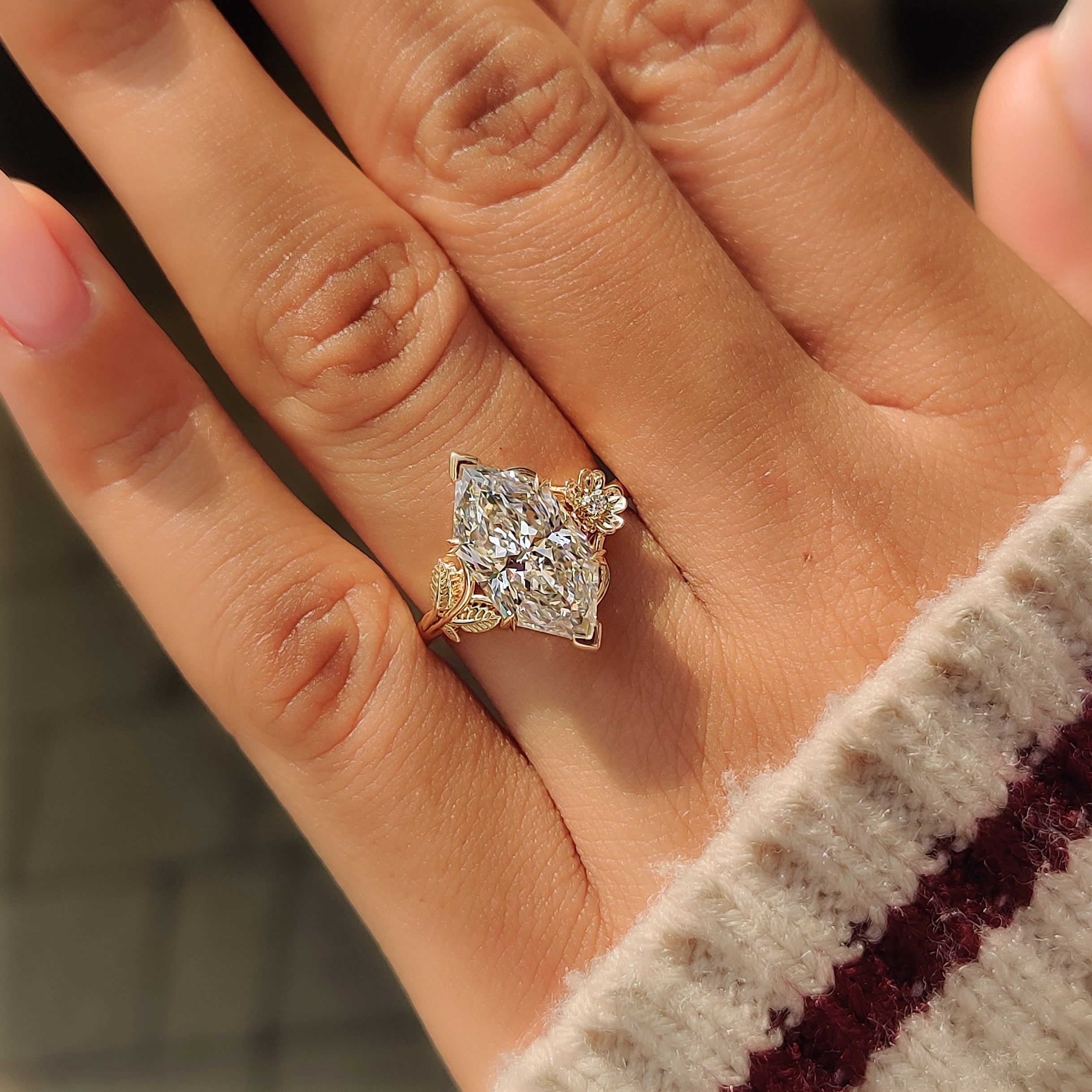 Dutch marquise lab grown diamond held by V shaped prongs.
