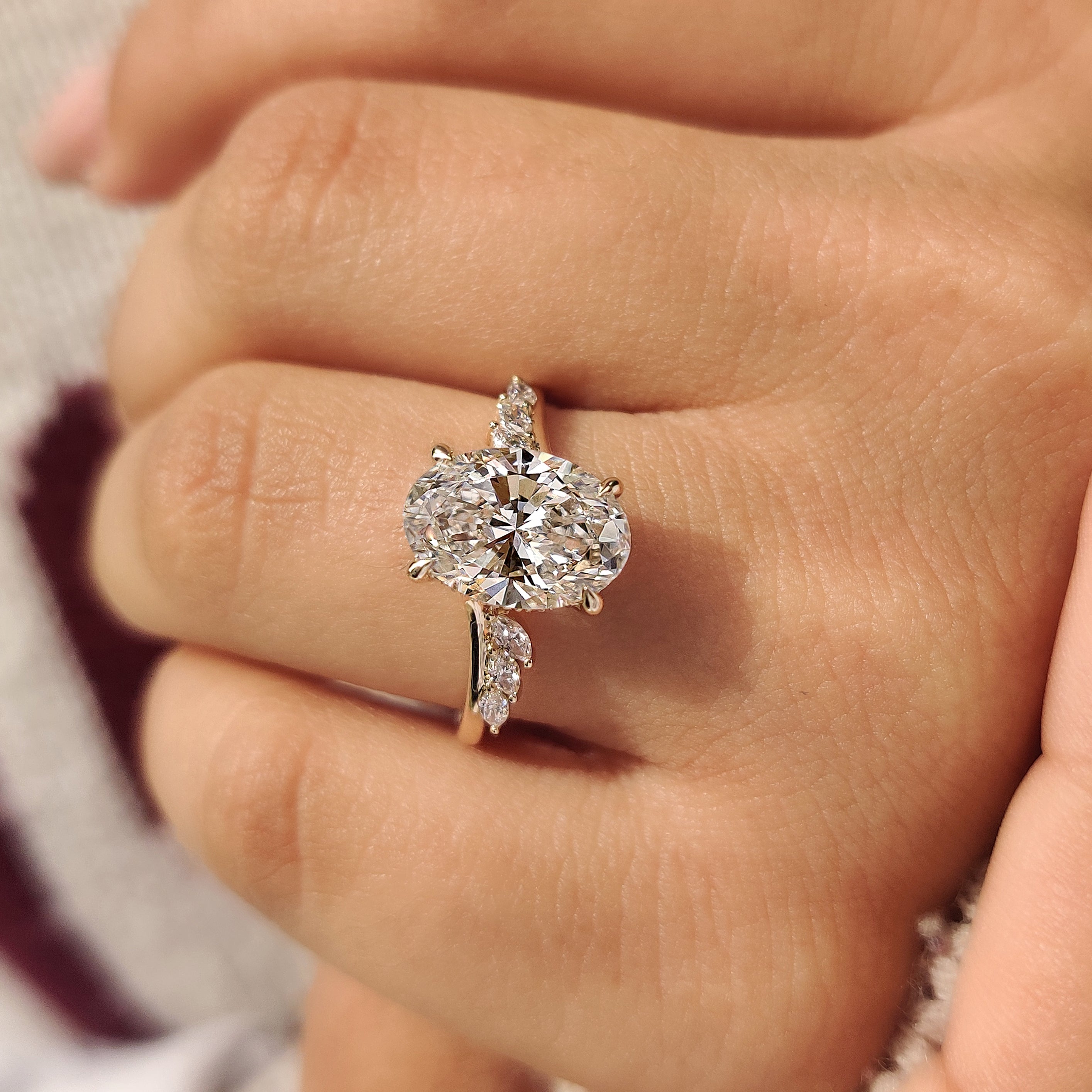 Oval ring with four claw prong setting.

