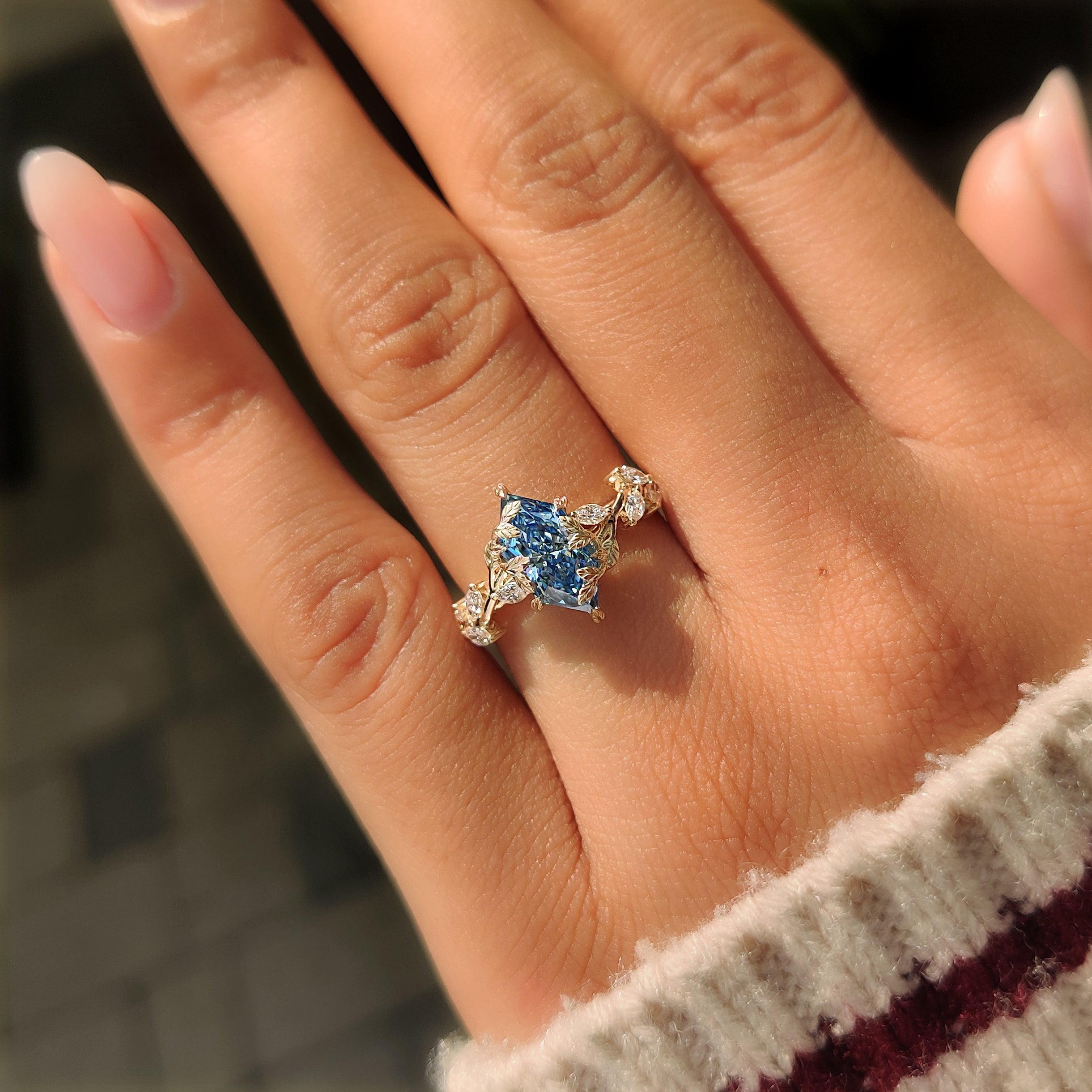 Back view of nature inspired blue Dutch marquise engagement ring.
