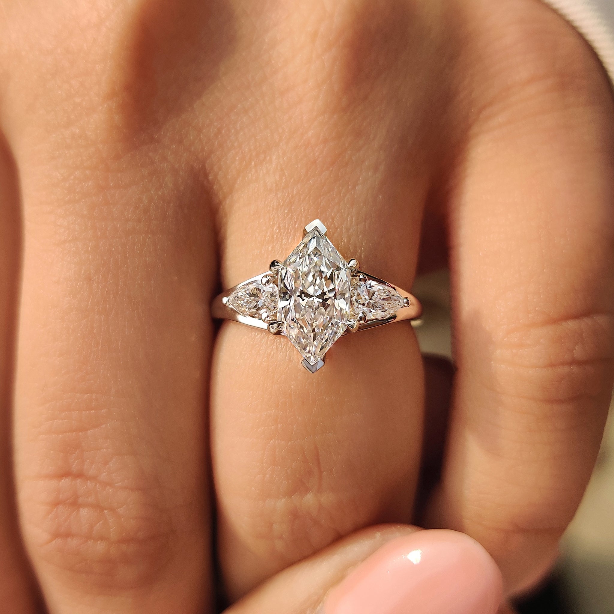 Dutch marquise engagement ring with V shape prong setting.

