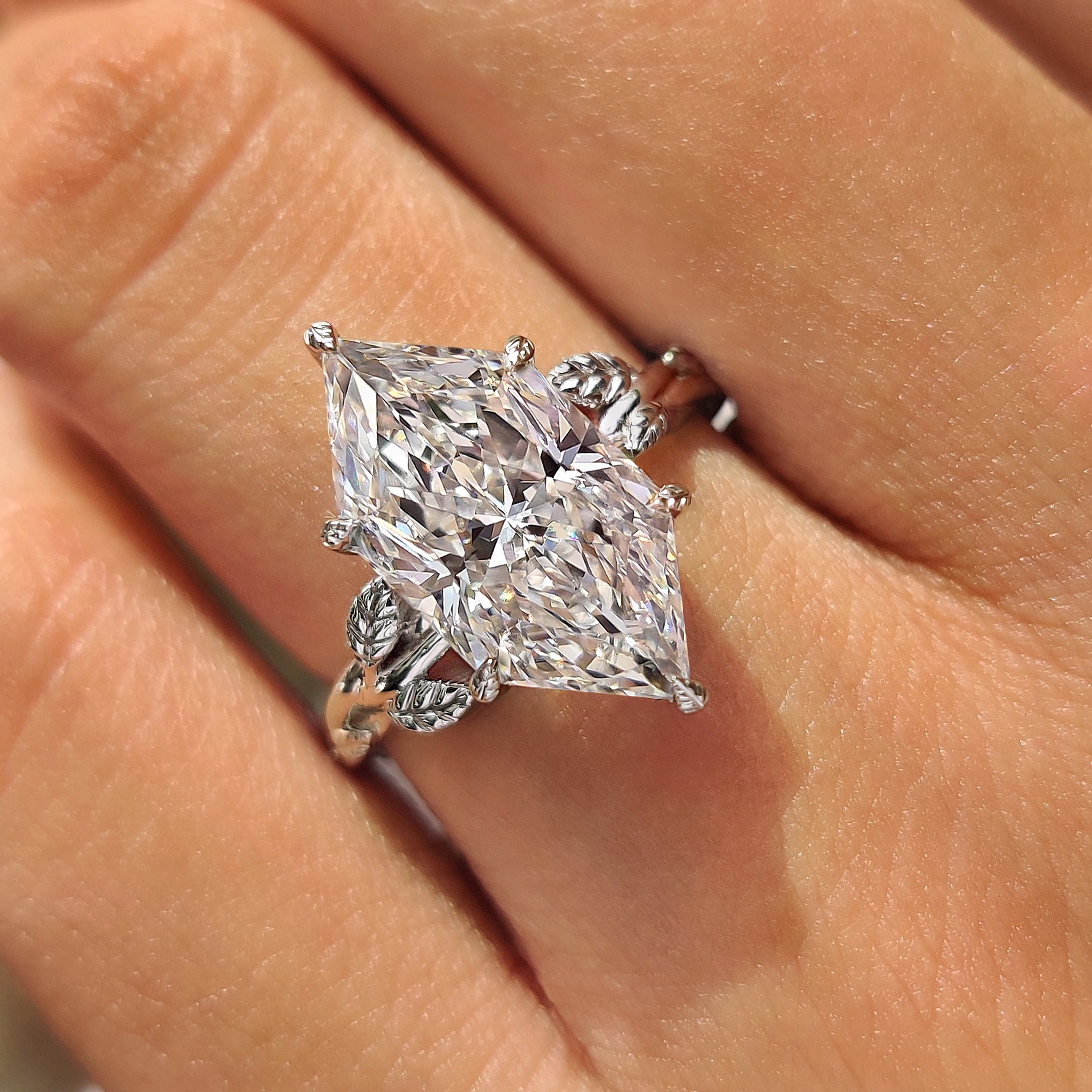 Dutch marquise diamond with leaf style prongs
